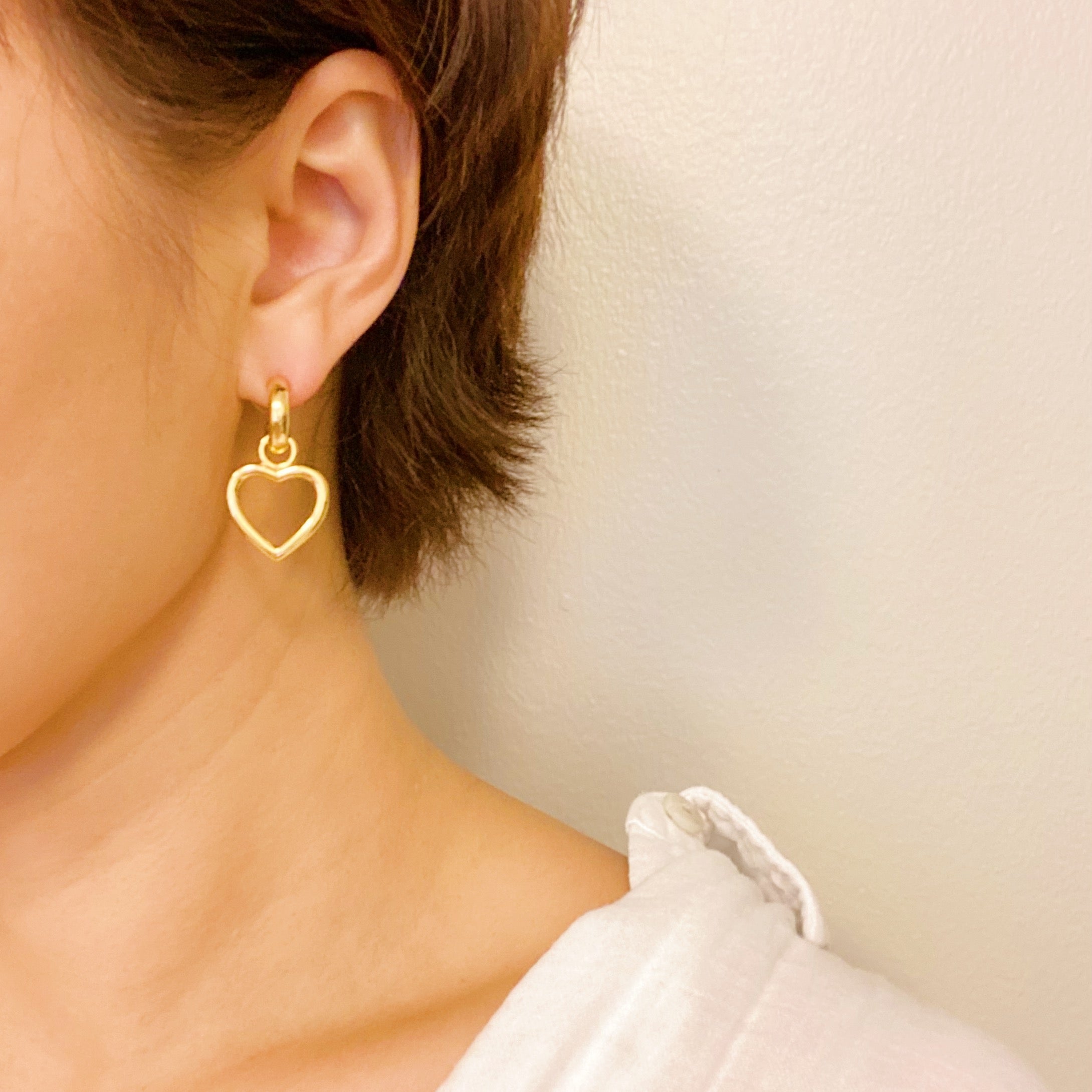 Love From Milan Heart Drop Earrings featuring a trendy dangling heart design in 18K gold plated brass.