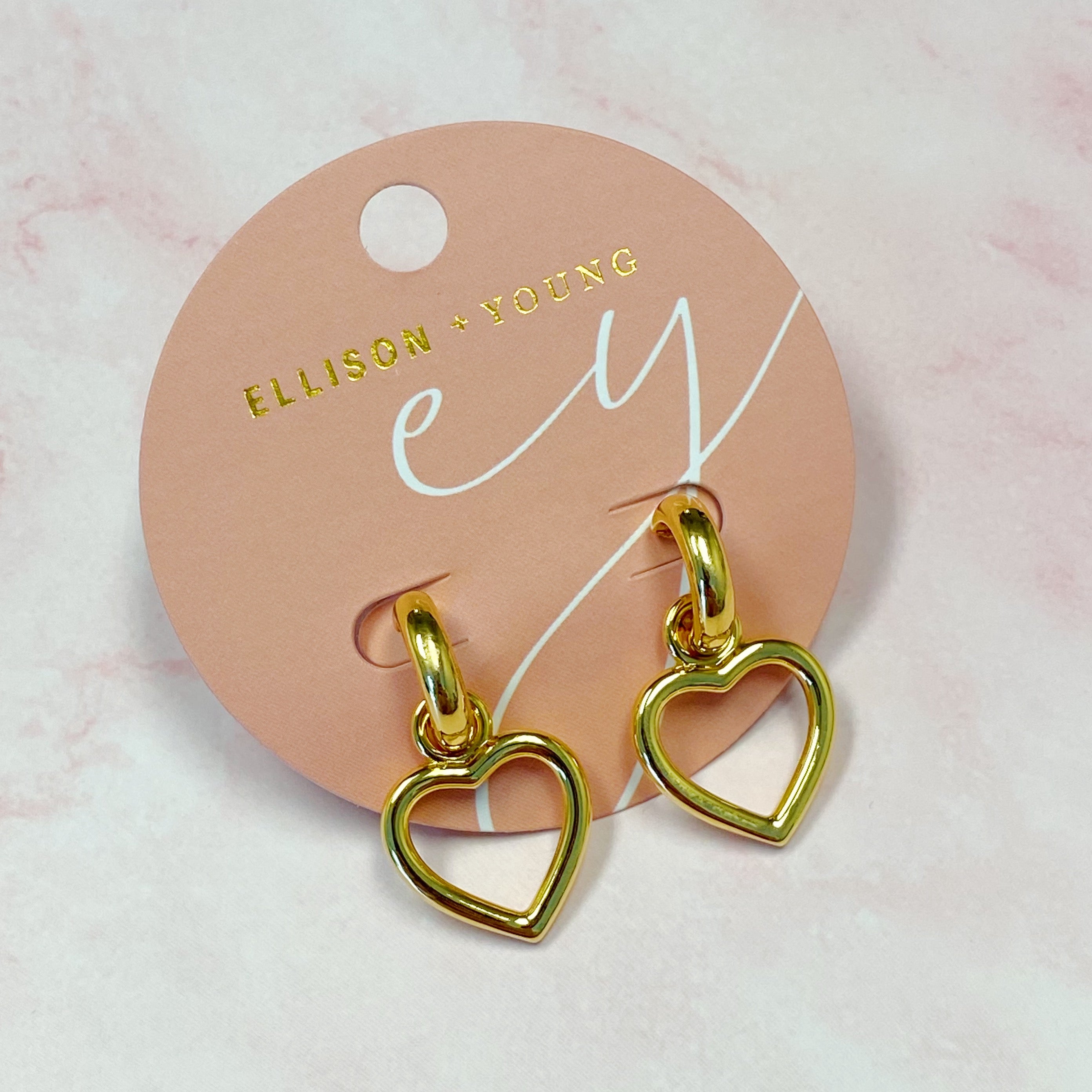 Love From Milan Heart Drop Earrings featuring a trendy dangling heart design in 18K gold plated brass.