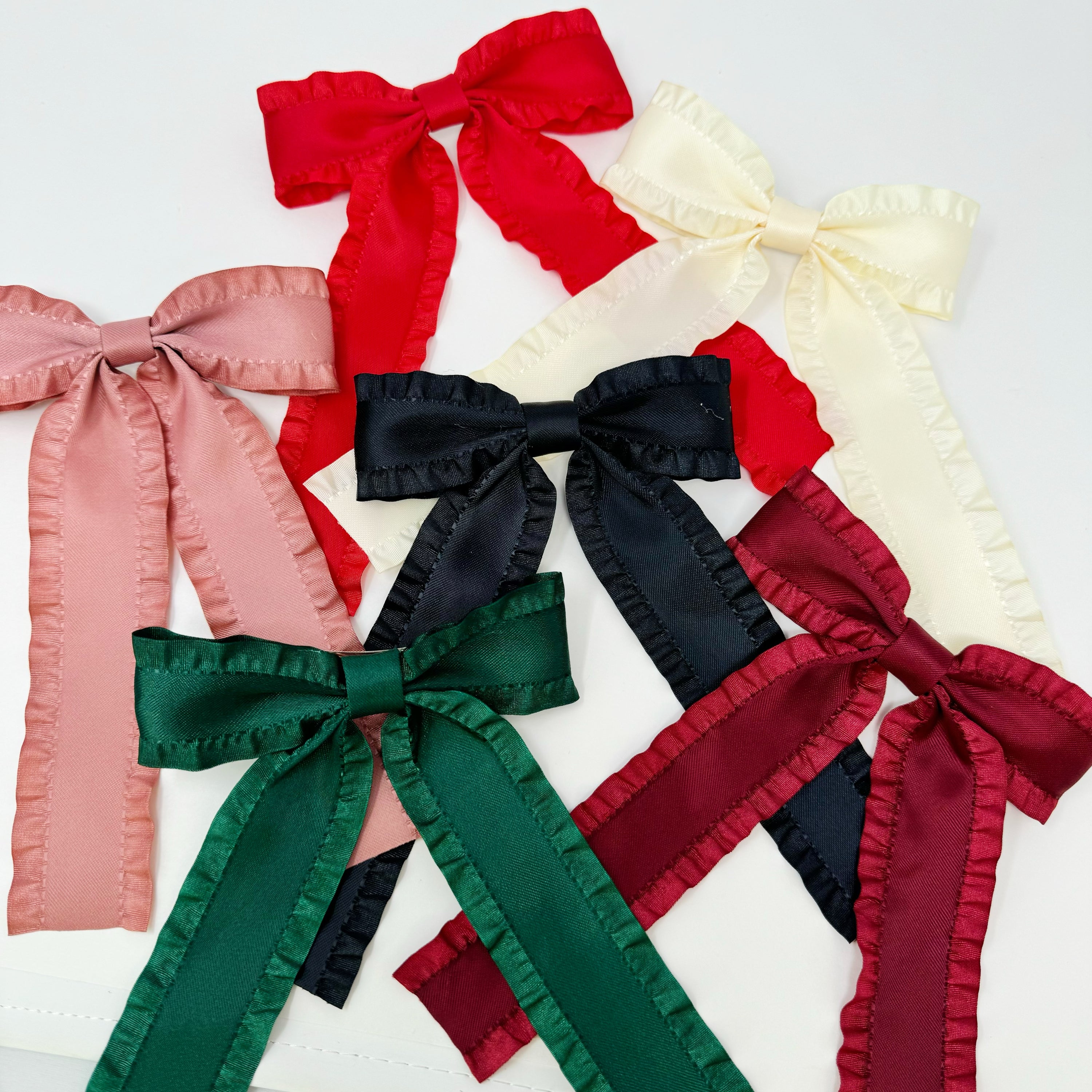 Love Game Frill Bow Hair Clip in vibrant colors with delicate frills, perfect for game days and holidays.