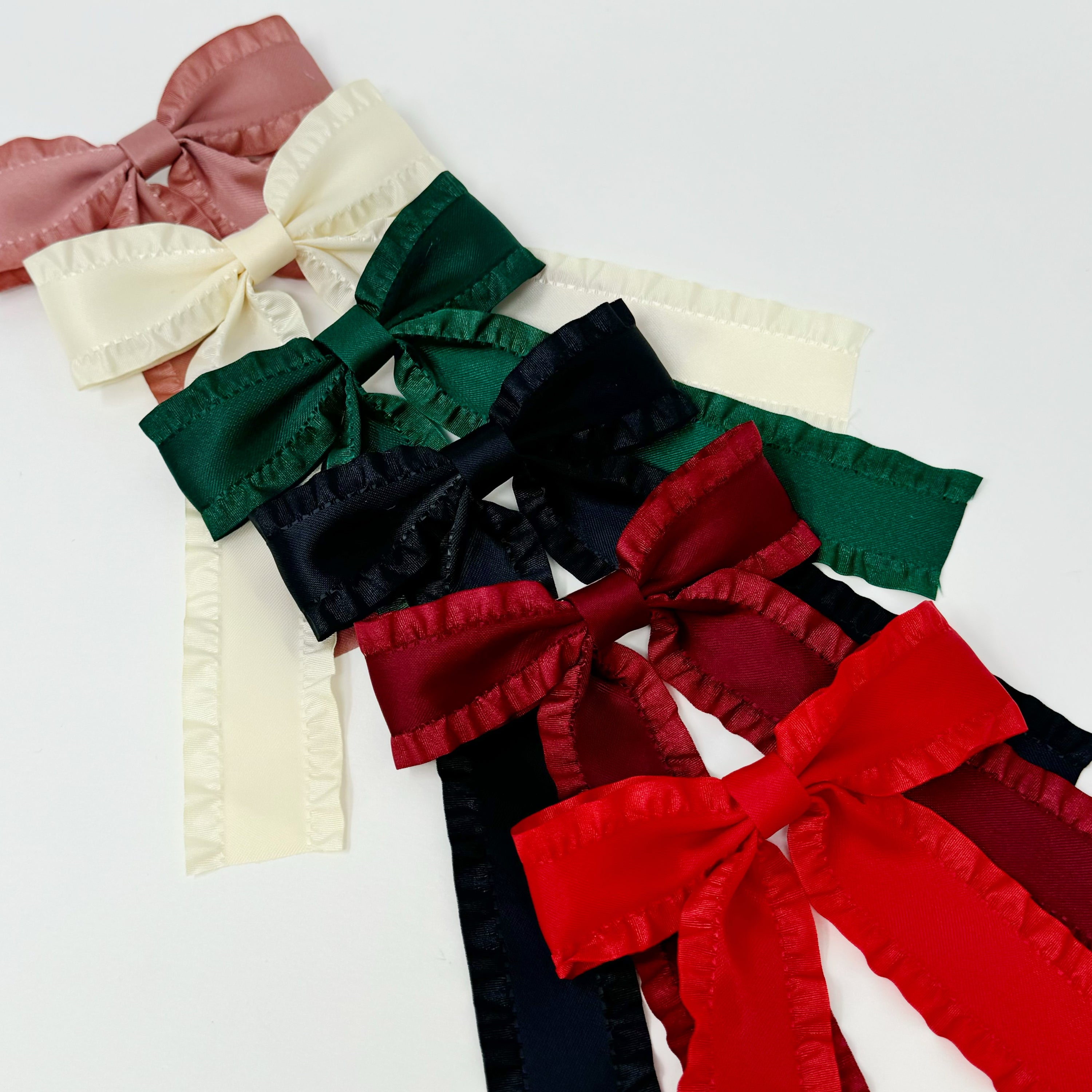 Love Game Frill Bow Hair Clip in vibrant colors with delicate frills, perfect for game days and holidays.