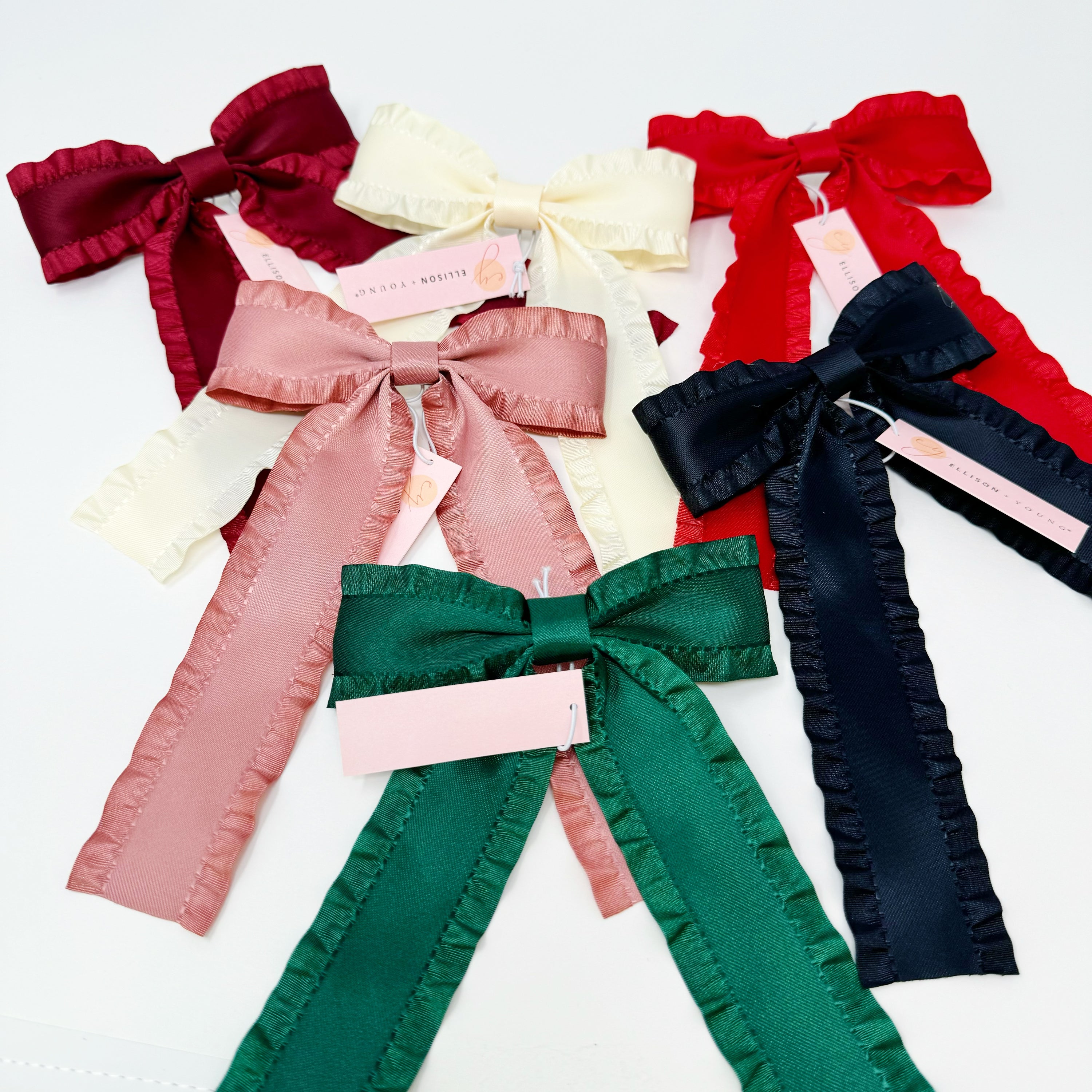 Love Game Frill Bow Hair Clip in vibrant colors with delicate frills, perfect for game days and holidays.