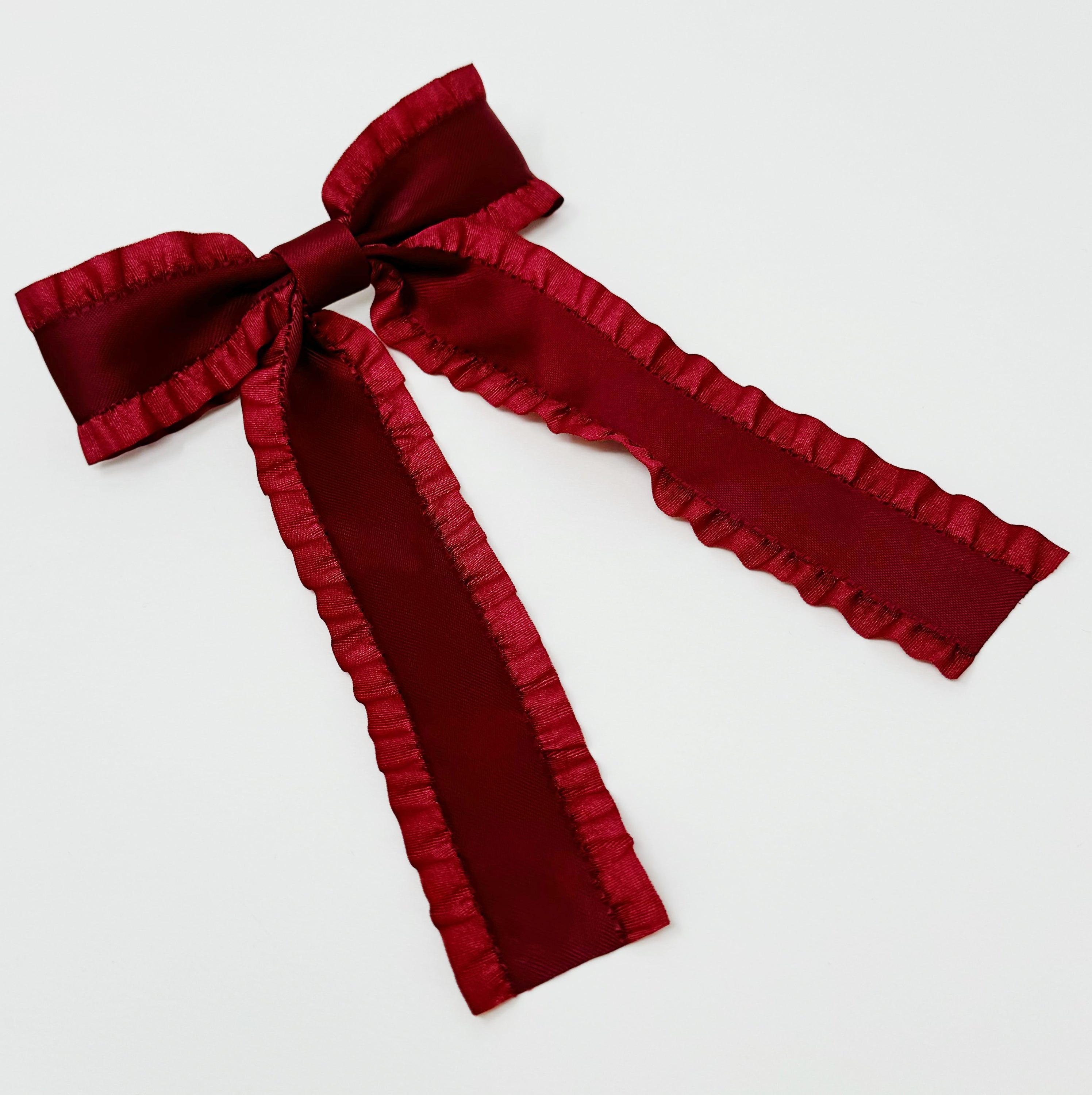 Love Game Frill Bow Hair Clip in vibrant colors with delicate frills, perfect for game days and holidays.