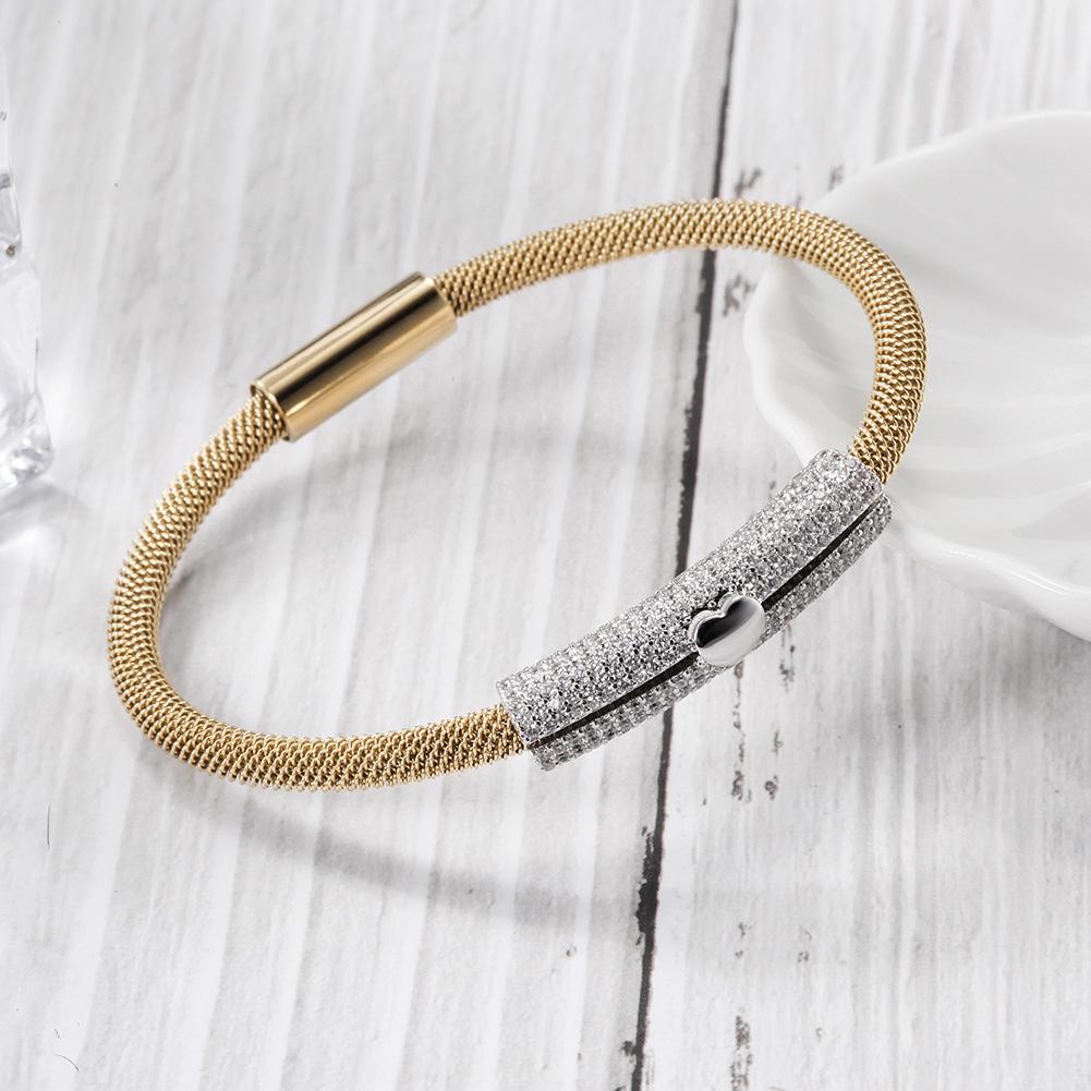 A stylish Love Heart Bangle made of 316L surgical stainless steel with 14K gold PVD plating, showcasing a heart design.