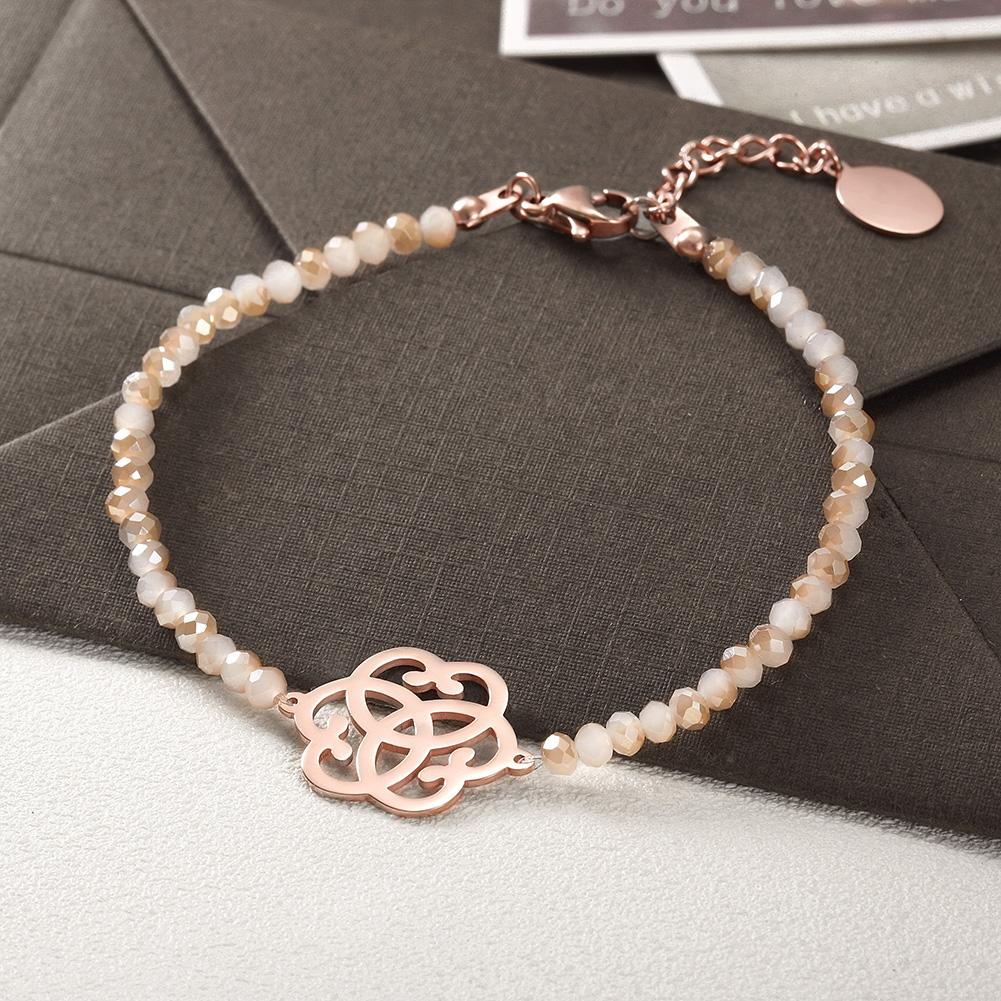 Love Knot Beaded Stone Bracelet made of surgical stainless steel with gold plating, featuring intricate knot design and elegant beaded stones.