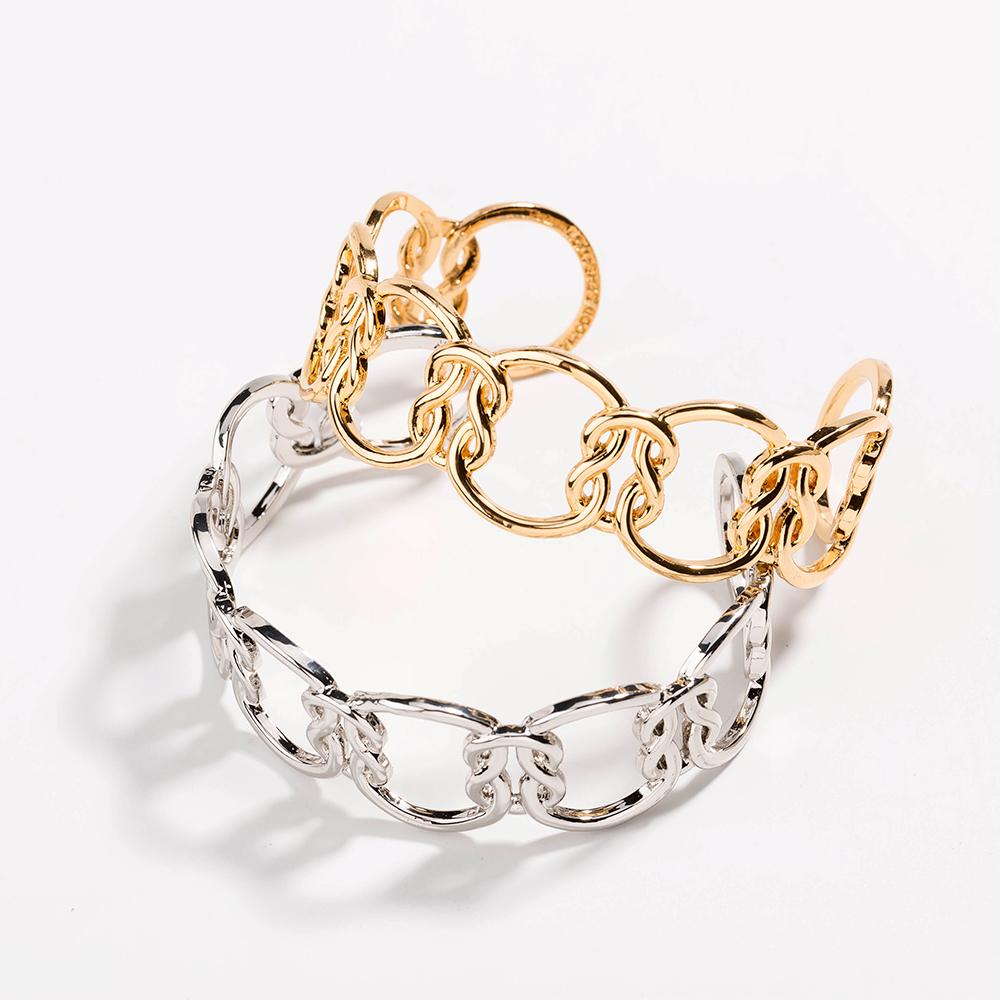 Elegant Love Knot Bracelet in 18k gold plating, symbolizing eternal love, displayed on a soft fabric background.