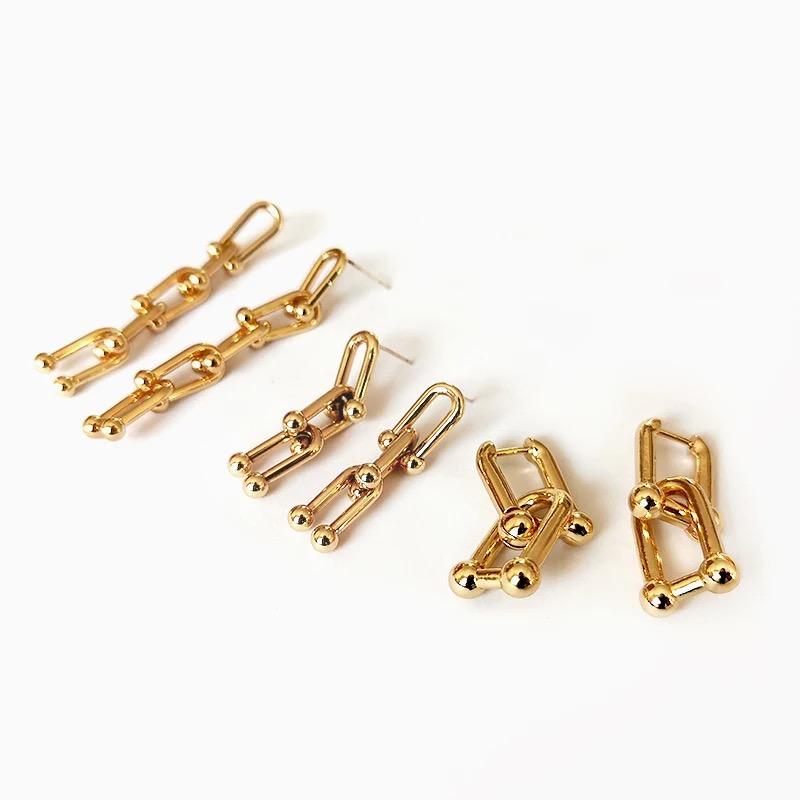 Stylish Love Links Earrings featuring a trendy link chain drop design in gold plated stainless steel.