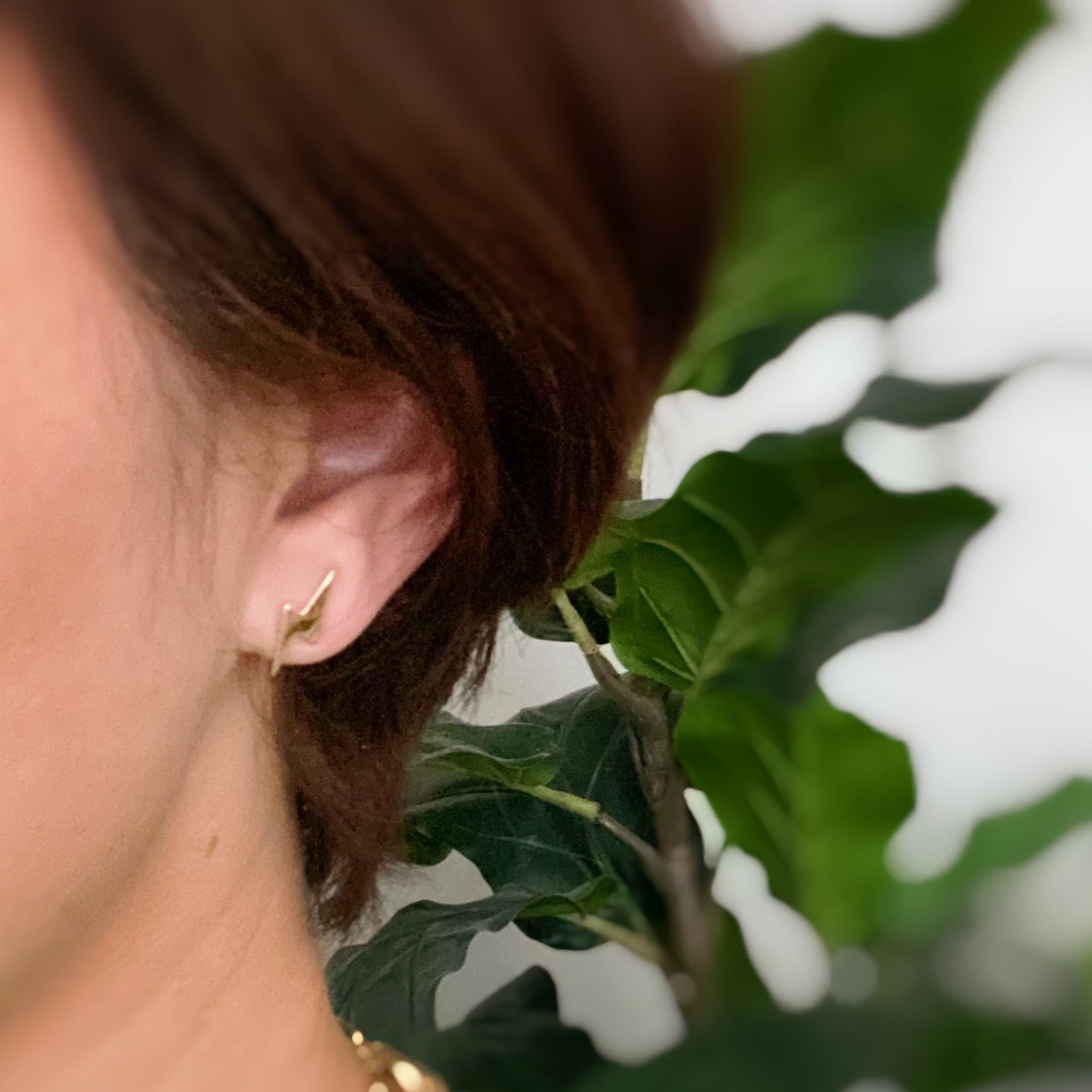 A set of four delicate stud earrings in unique shapes, showcasing 18k gold plating and premium craftsmanship.