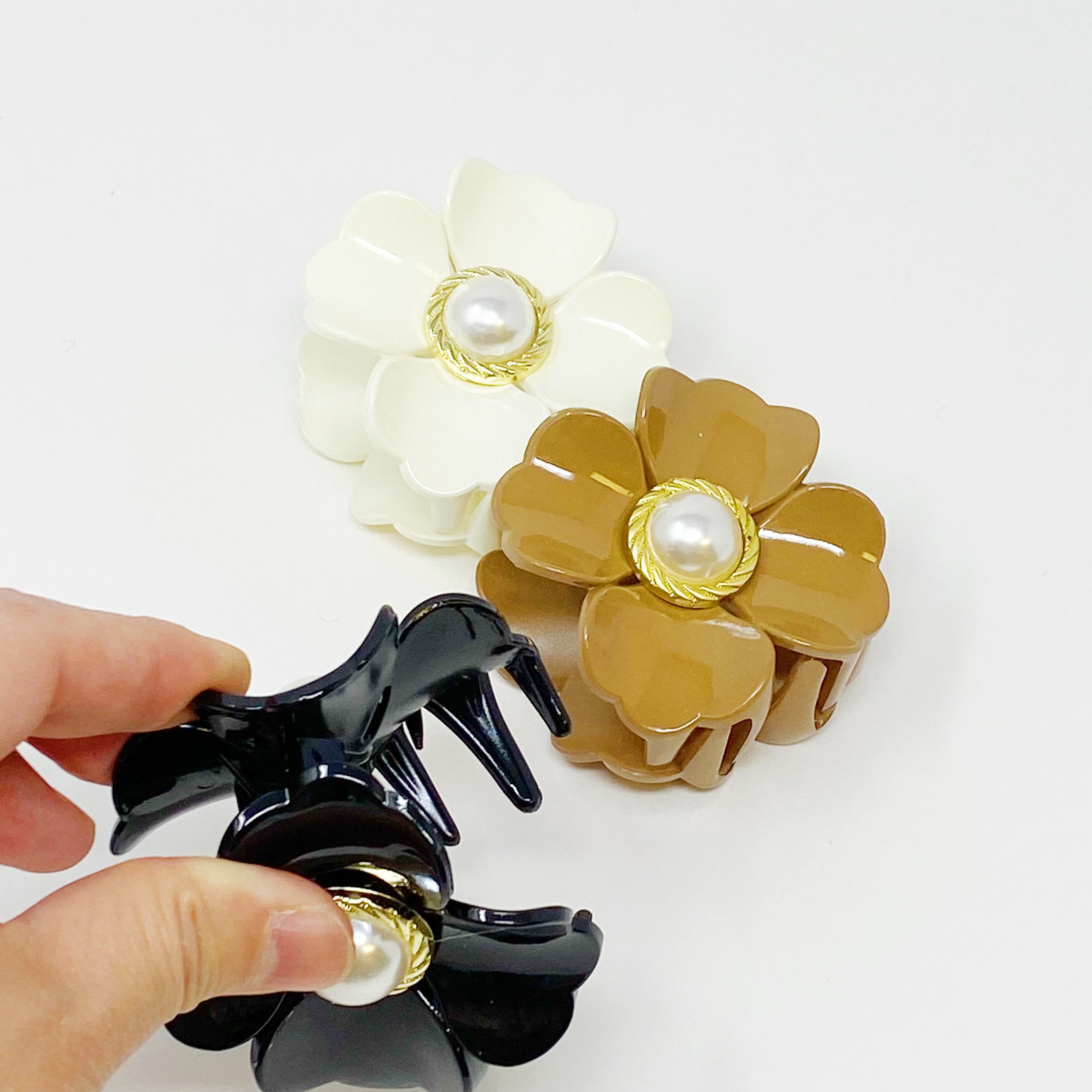 Loved By Coco Flower Hair Claw Set featuring three elegant hair claws with pearl-centered flowers in stylish color combinations.