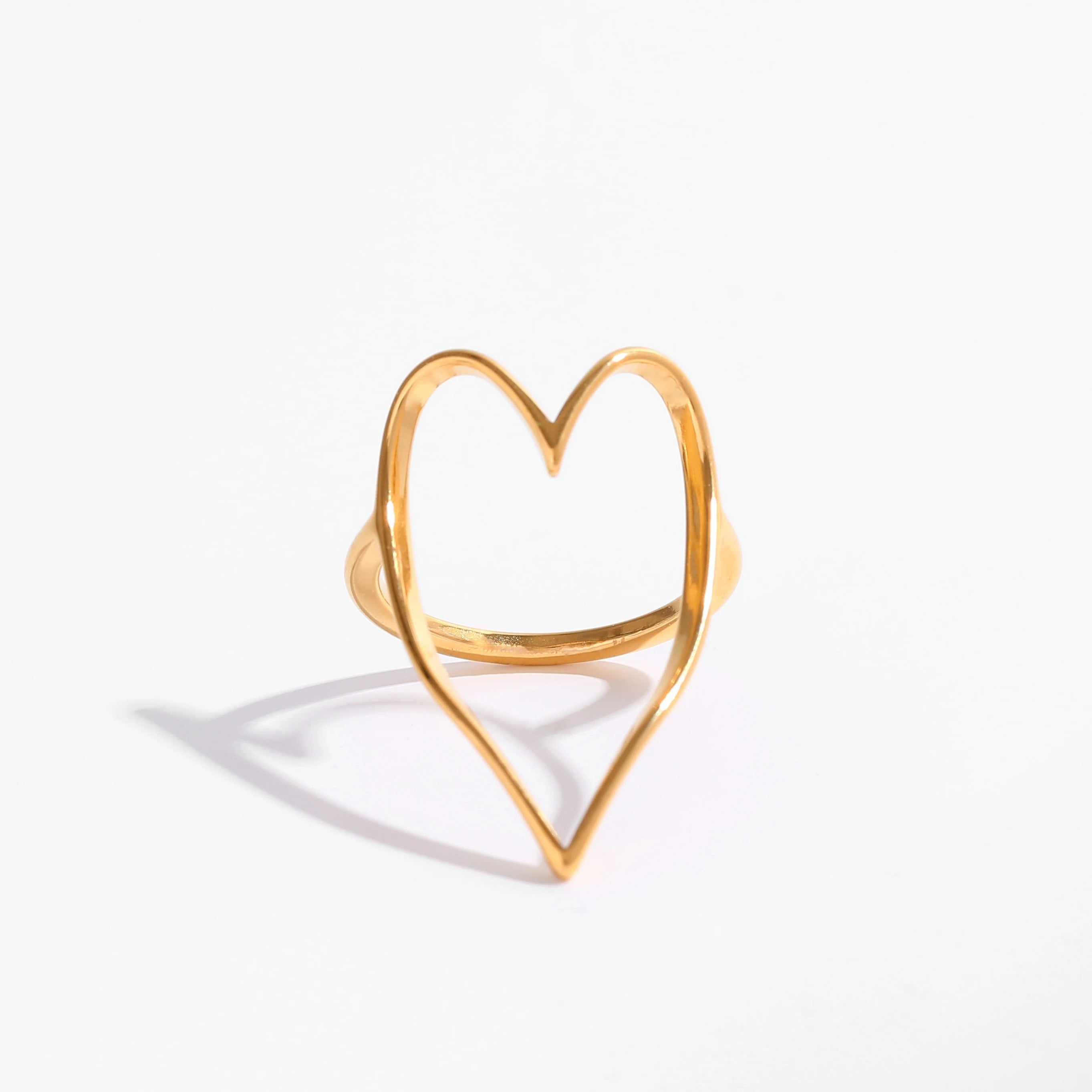 Lovestruck Open Heart Ring featuring a delicate heart design in stainless steel with 18Kt yellow gold PVD plating.