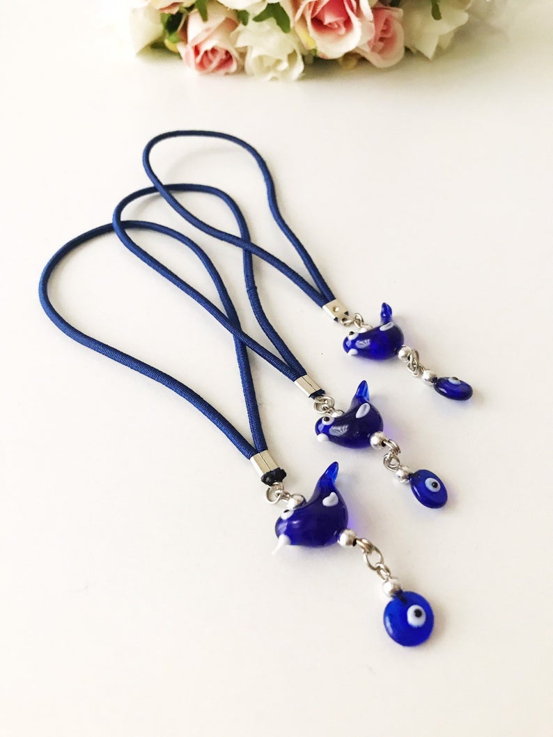 Handmade Lucky Bird car rear view mirror charm featuring glass bird and evil eye beads, perfect for car decoration.