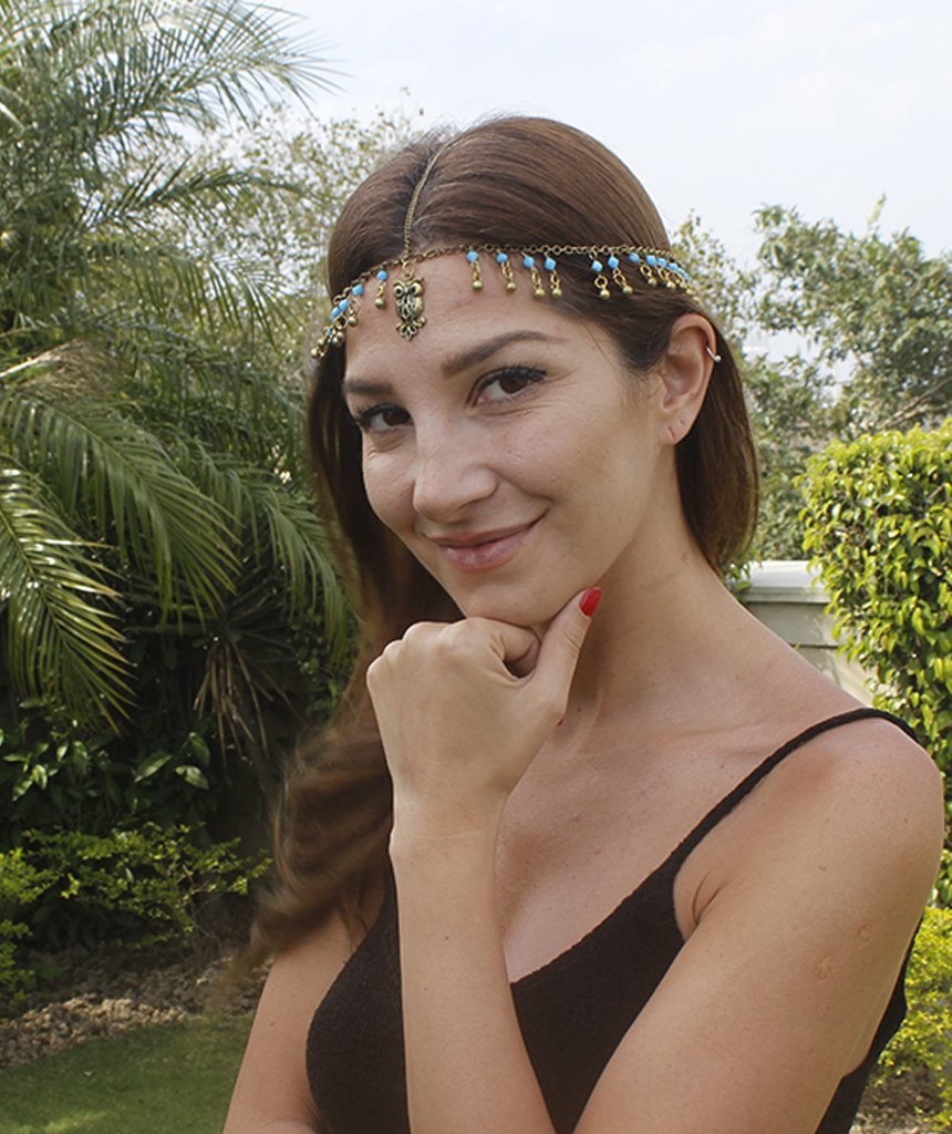 A beautiful gold head chain featuring a charming owl pendant with turquoise and blue beads, perfect for festivals and stylish outfits.