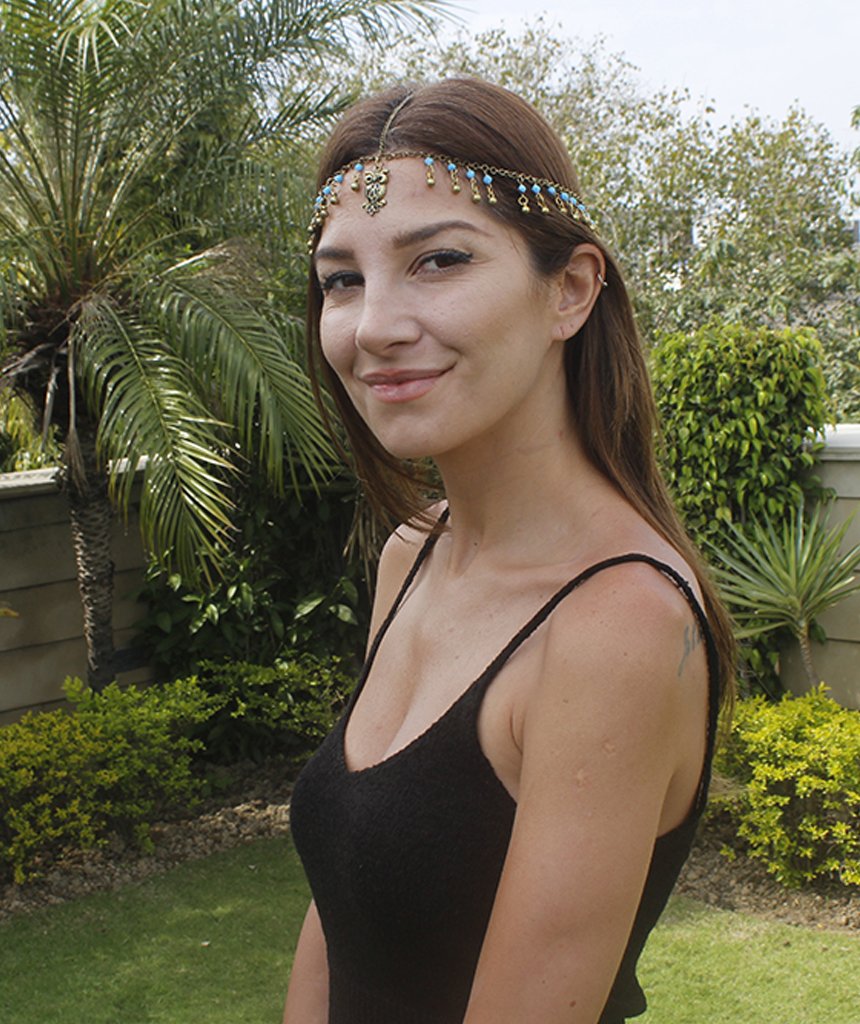 A beautiful gold head chain featuring a charming owl pendant with turquoise and blue beads, perfect for festivals and stylish outfits.