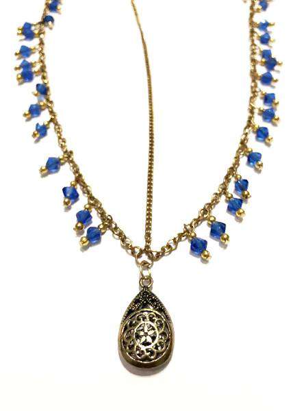 A beautiful gold head chain featuring a charming owl pendant with turquoise and blue beads, perfect for festivals and stylish outfits.