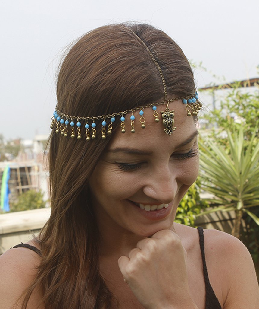 A beautiful gold head chain featuring a charming owl pendant with turquoise and blue beads, perfect for festivals and stylish outfits.