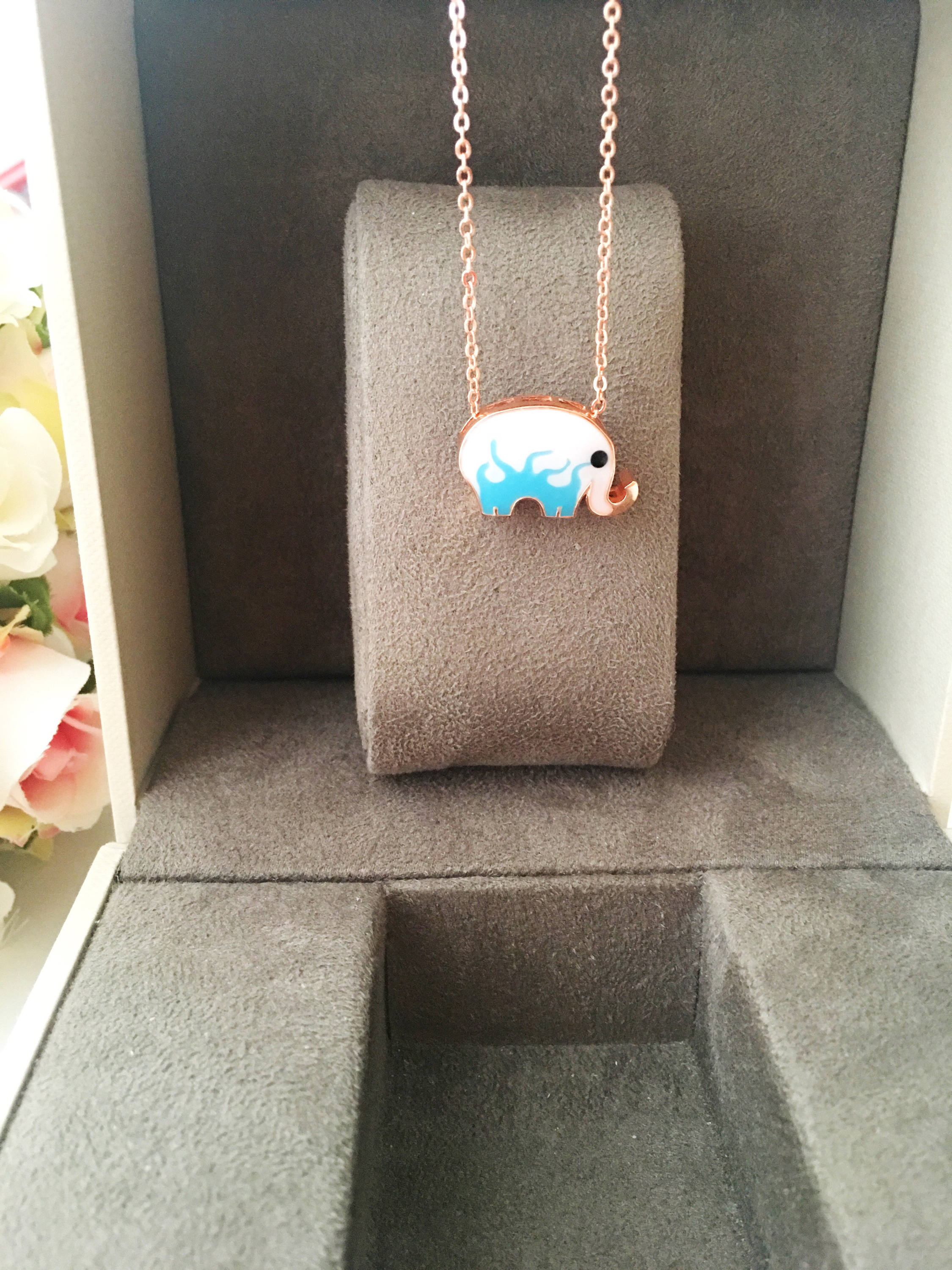 Handmade Lucky Elephant Necklace featuring a blue elephant charm and an evil eye pendant on a stainless steel chain.