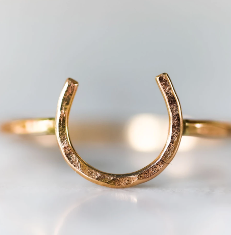 A handmade Lucky Horseshoe Ring crafted from 18 gauge wire, featuring a unique horseshoe design symbolizing good luck.