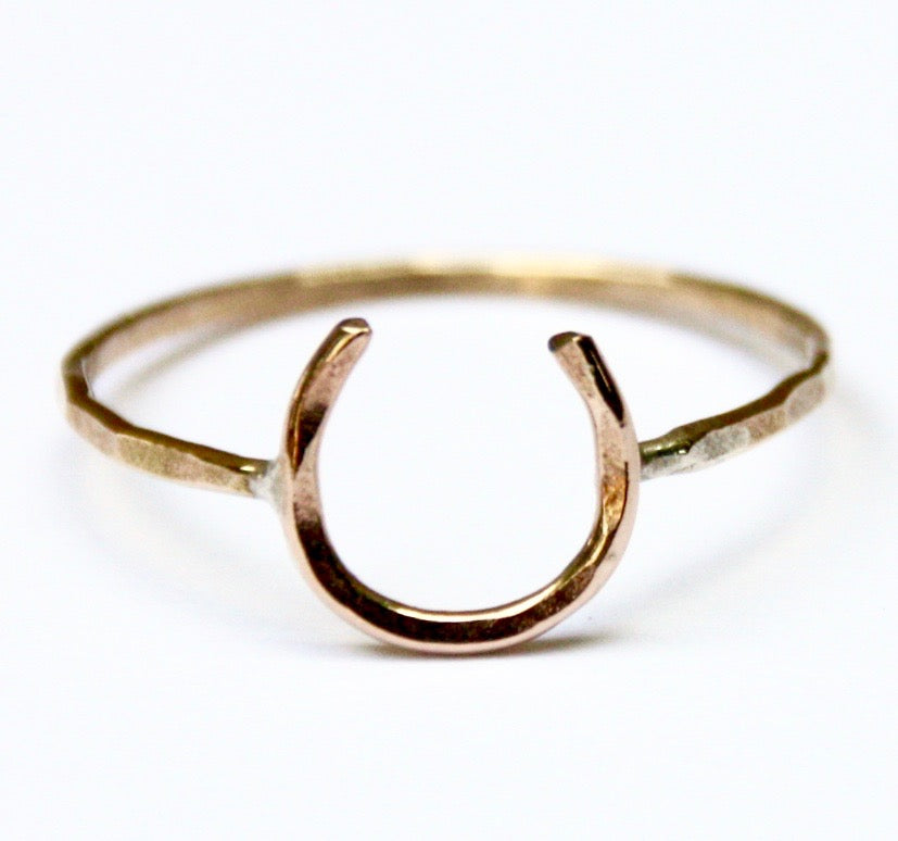 A handmade Lucky Horseshoe Ring crafted from 18 gauge wire, featuring a unique horseshoe design symbolizing good luck.