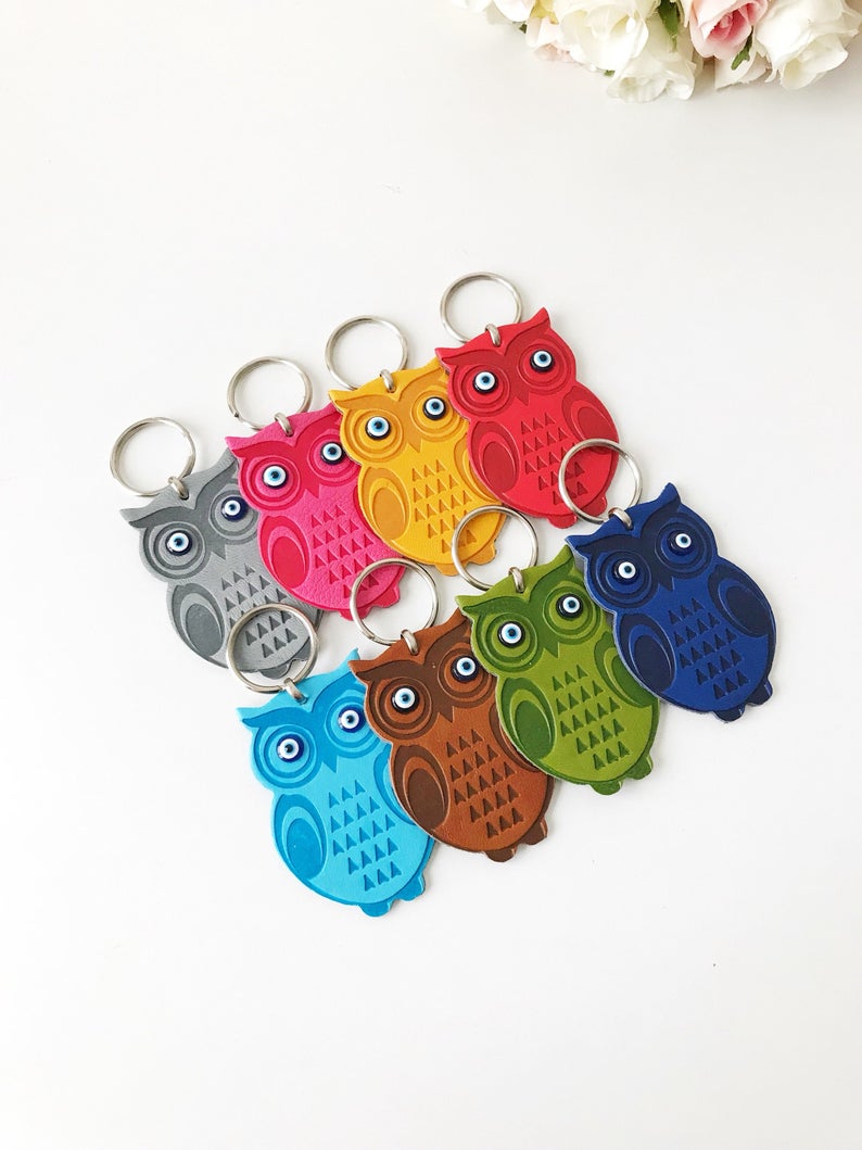 Lucky owl keychain featuring evil eye protection, made of suede leather with colorful resin beads.