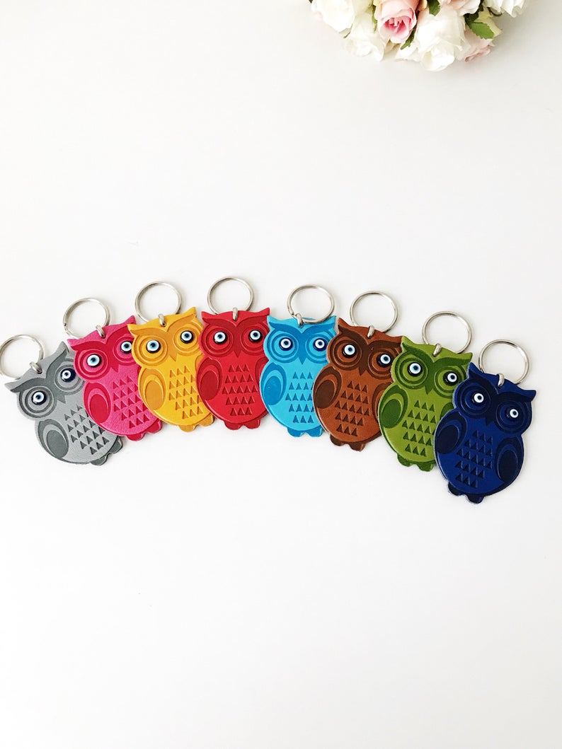 Lucky owl keychain featuring evil eye protection, made of suede leather with colorful resin beads.