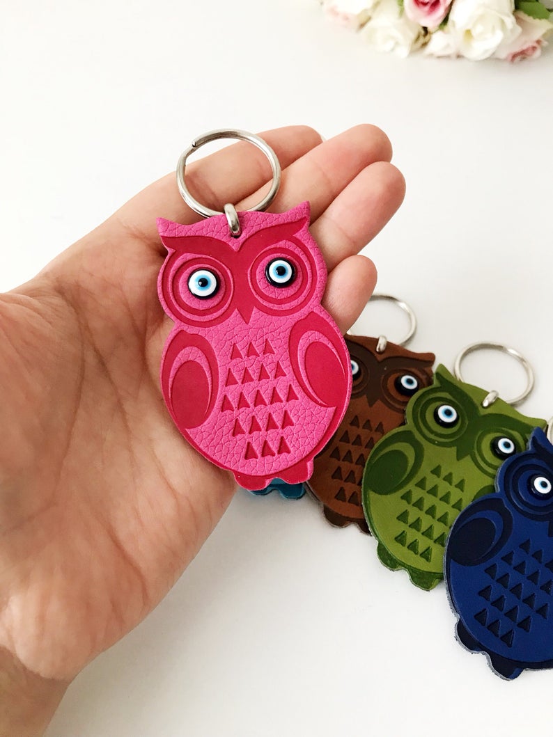 Lucky owl keychain featuring evil eye protection, made of suede leather with colorful resin beads.