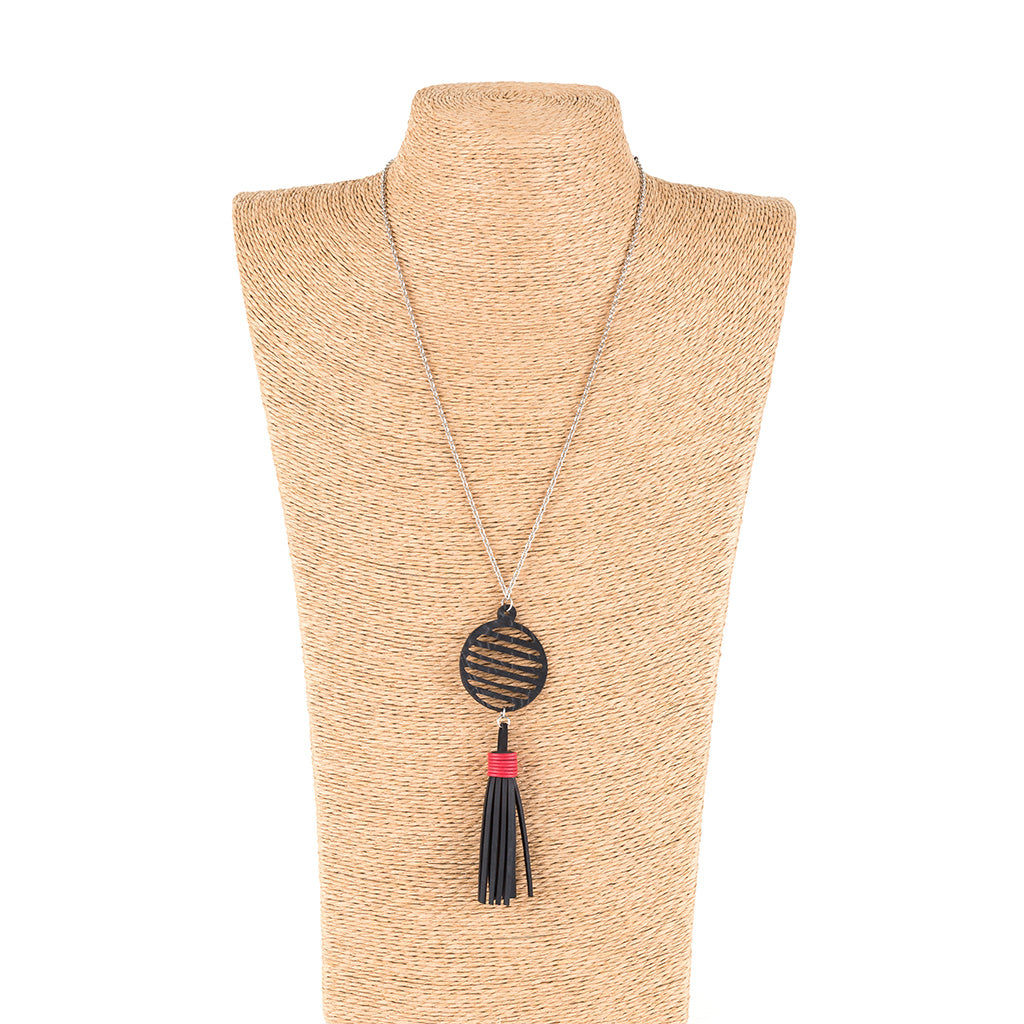 Lunar Rubber Tassel Necklace featuring reclaimed rubber and a colorful tassel, elegantly displayed on a neutral background.