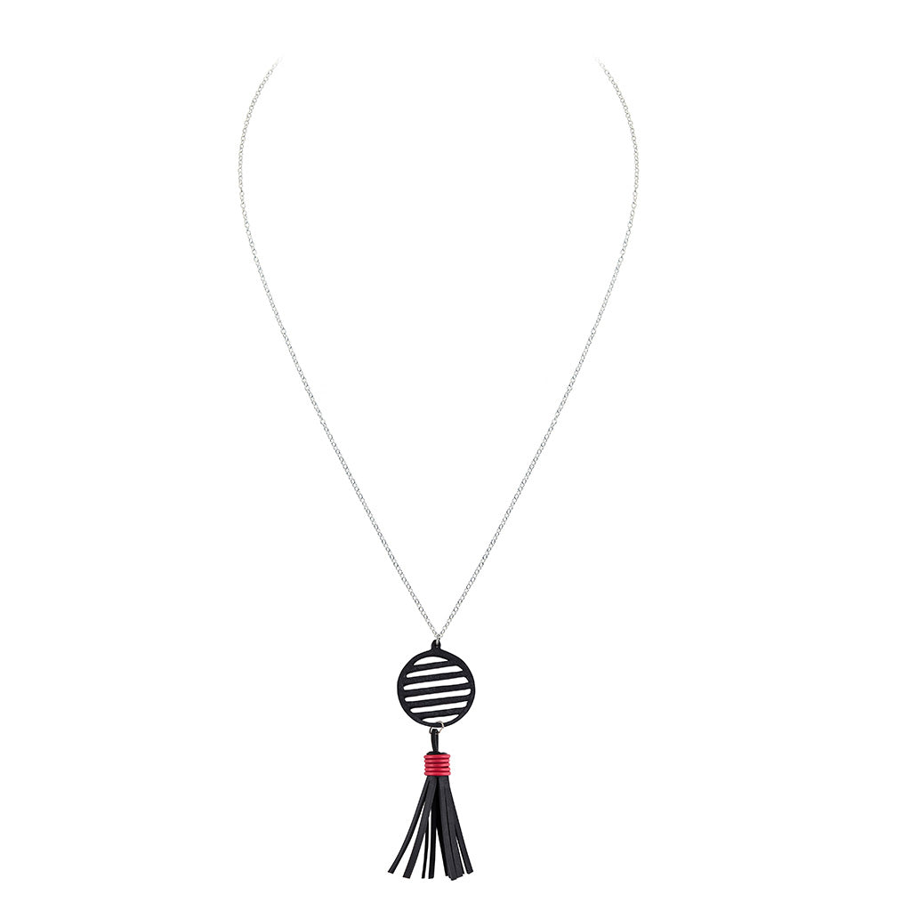 Lunar Rubber Tassel Necklace featuring reclaimed rubber and a colorful tassel, elegantly displayed on a neutral background.