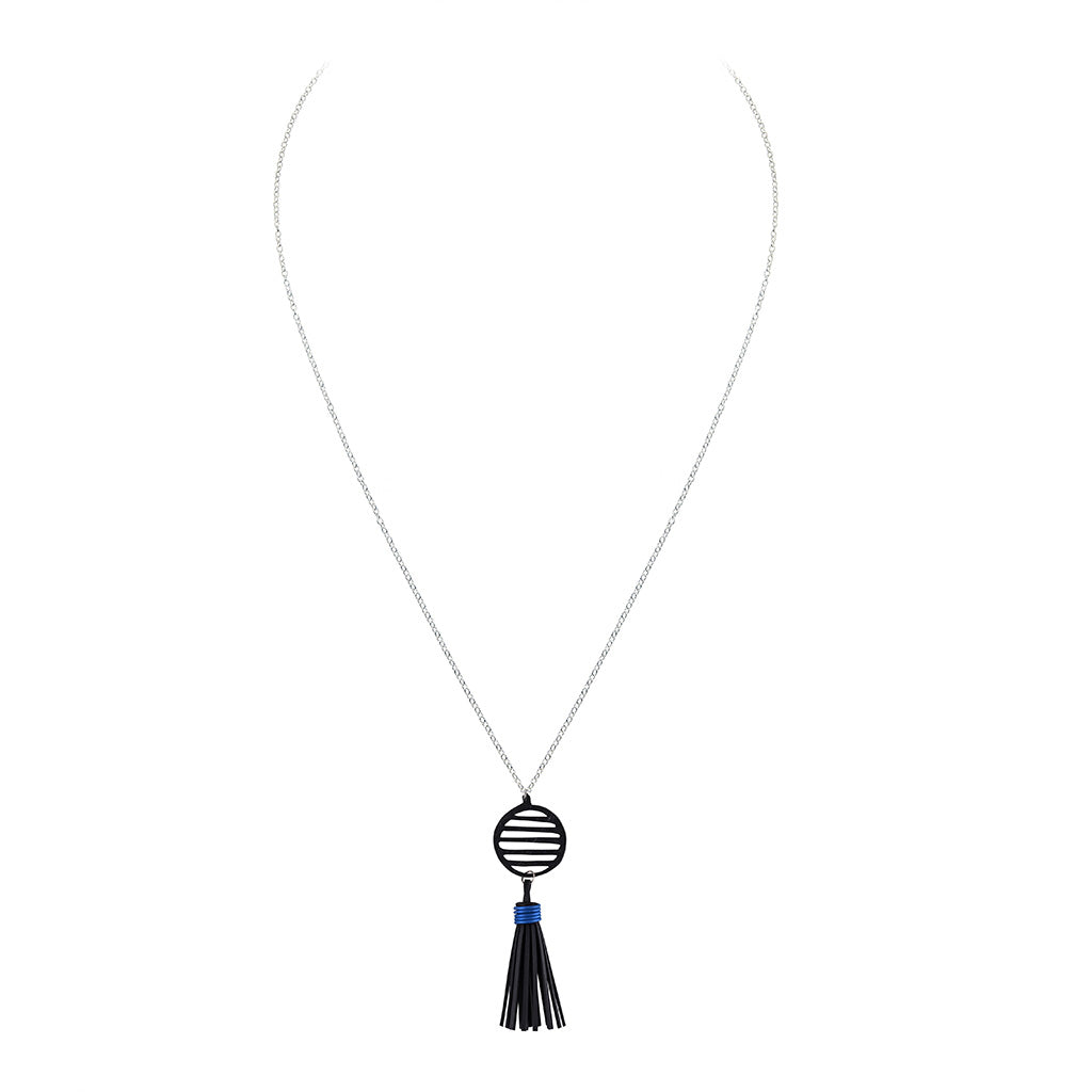 Lunar Rubber Tassel Necklace featuring reclaimed rubber and a colorful tassel, elegantly displayed on a neutral background.