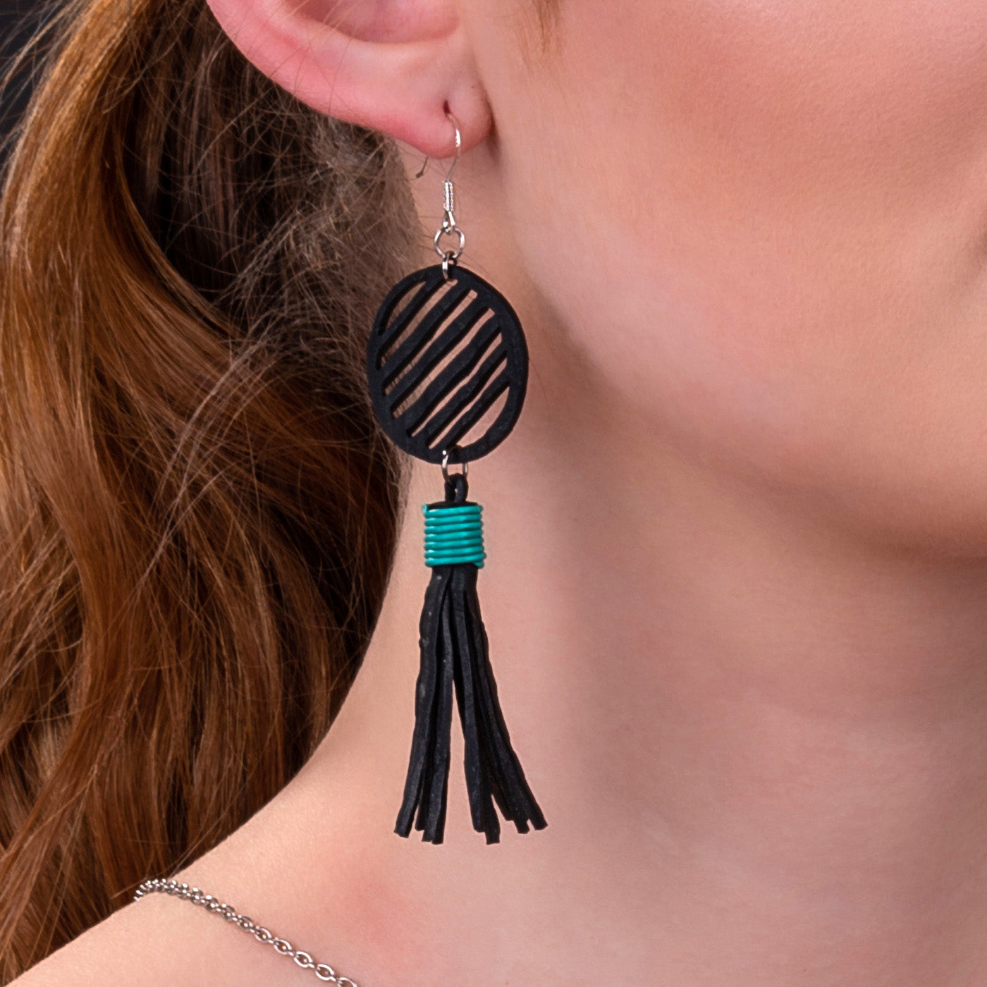 Lunar Upcycled Rubber Tassel Earrings featuring reclaimed rubber and recycled electrical wire, elegantly designed with sterling silver hooks.