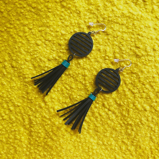 Lunar Upcycled Rubber Tassel Earrings featuring reclaimed rubber and recycled electrical wire, elegantly designed with sterling silver hooks.