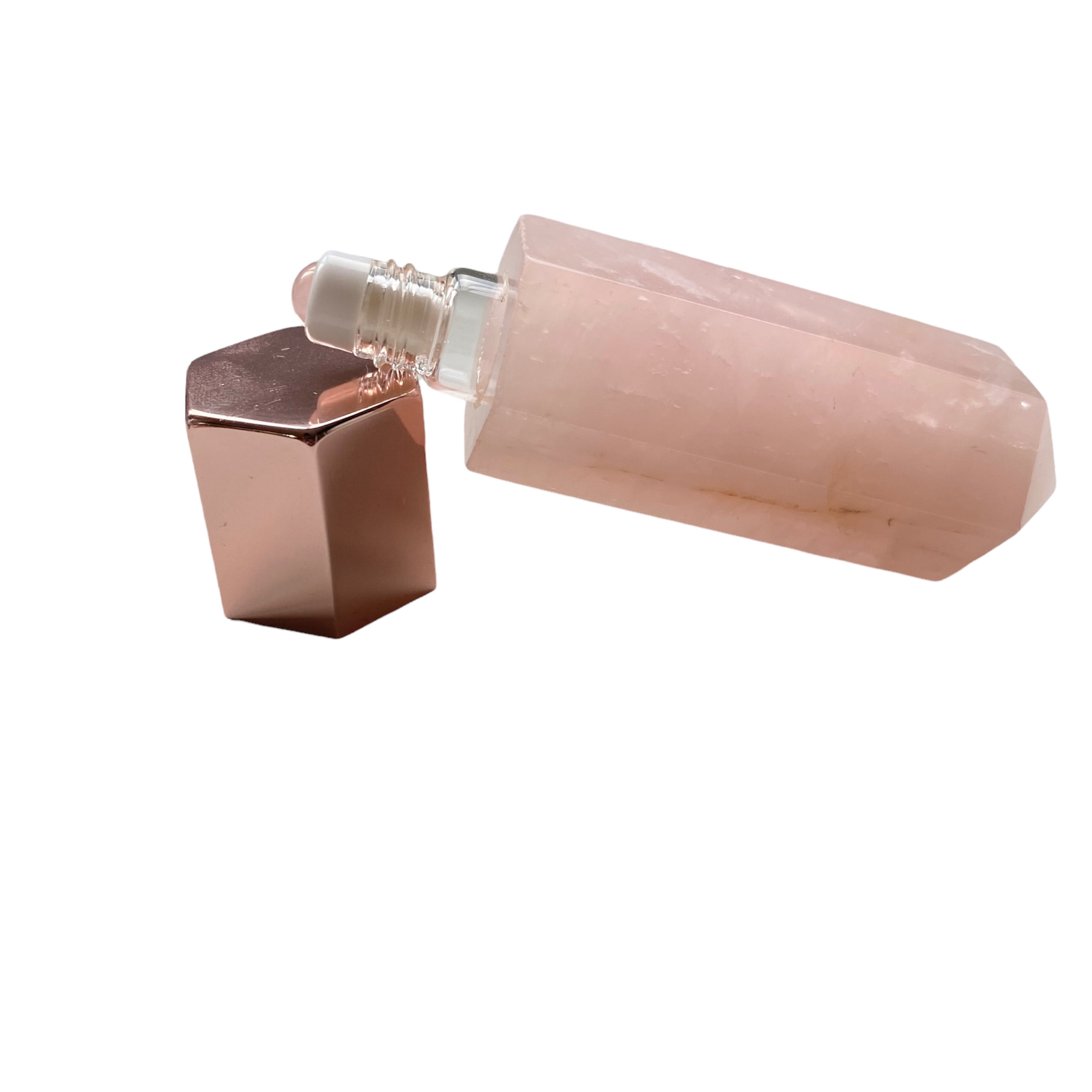 A luxurious gemstone perfume bottle featuring a stunning gemstone point roller design, available in Opalite, Amethyst, Rose Quartz, and Green Fluorite.