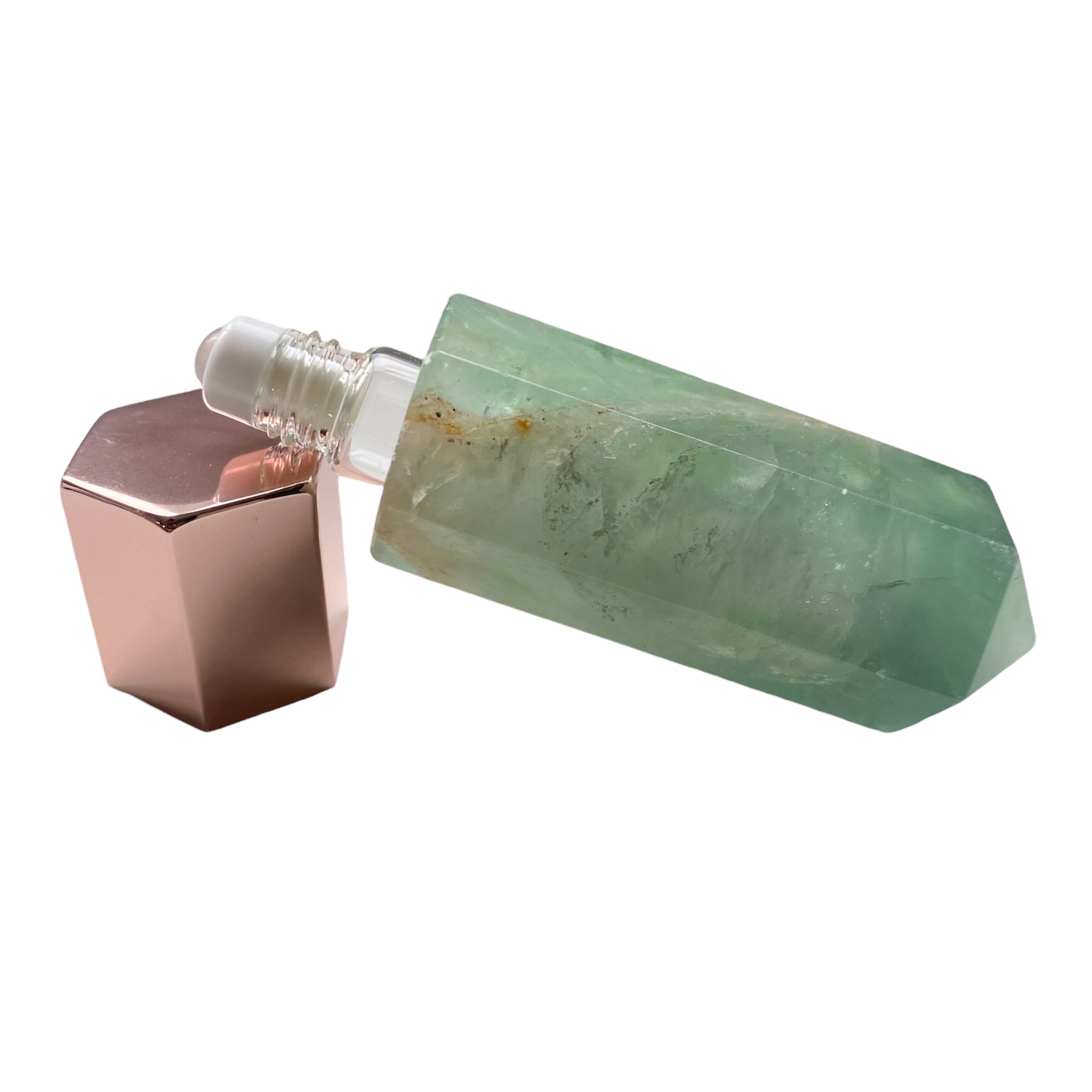 A luxurious gemstone perfume bottle featuring a stunning gemstone point roller design, available in Opalite, Amethyst, Rose Quartz, and Green Fluorite.