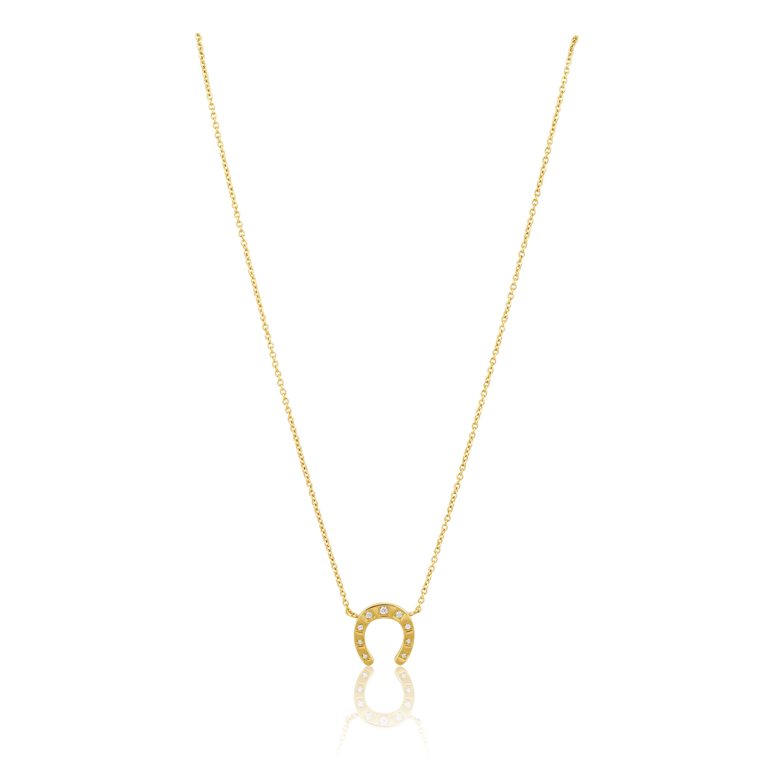 Maddox Horseshoe Necklace featuring a classic horseshoe design, 18K gold plated over sterling silver, displayed elegantly.