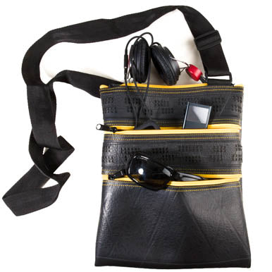 Maggie Special Recycled Rubber Vegan Handbag featuring unique hand-punched panels and adjustable strap, made from reclaimed inner tubes.