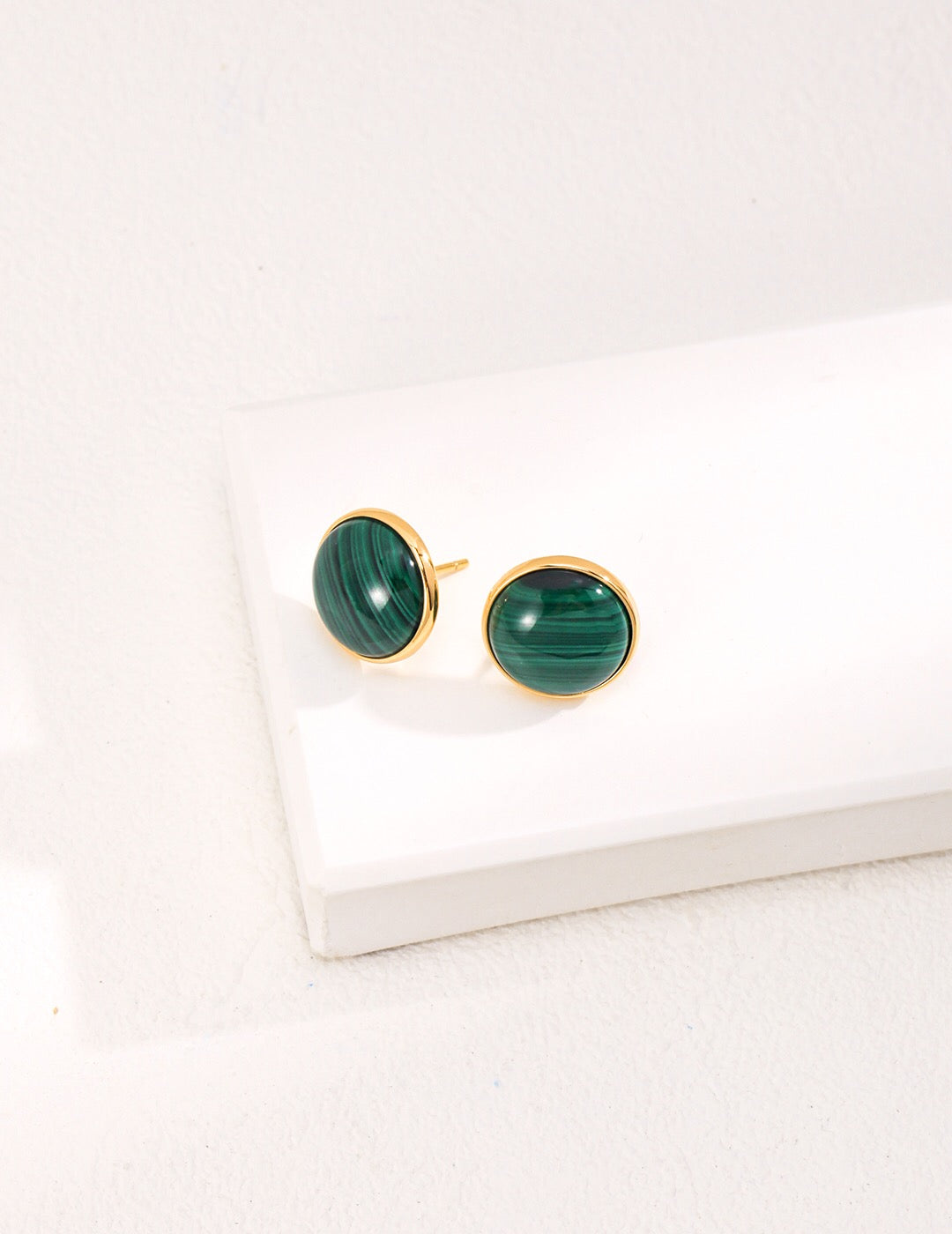 Handmade Malachite Stud Earrings featuring sterling silver and gold vermeil, showcasing vibrant green hues and intricate patterns.