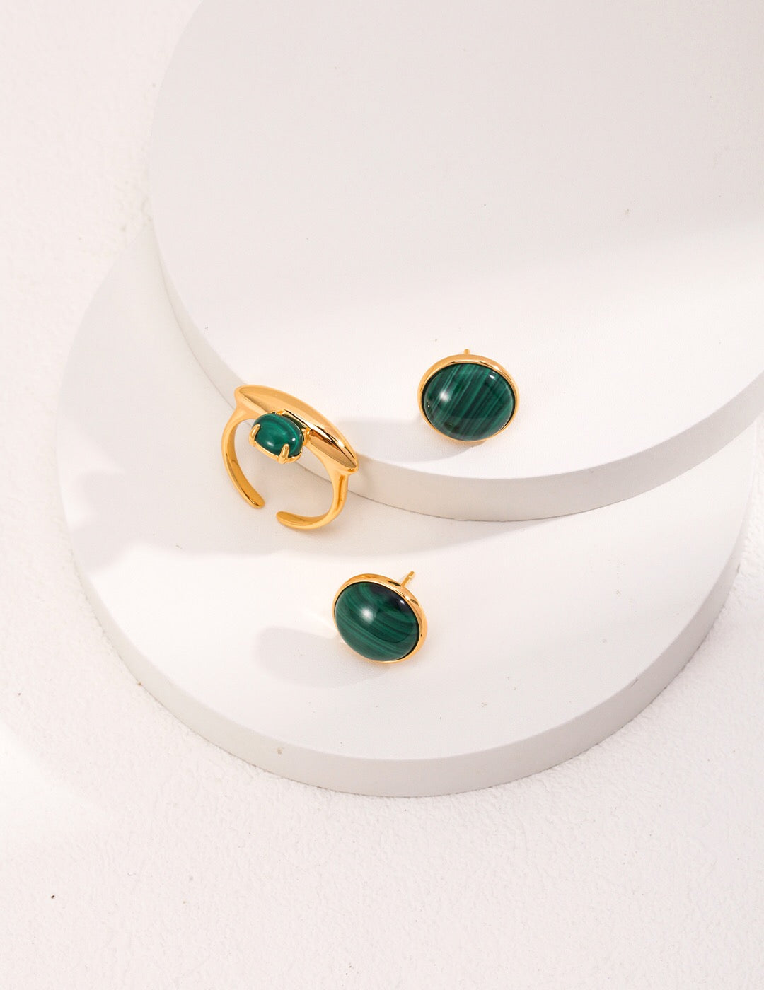 Handmade Malachite Stud Earrings featuring sterling silver and gold vermeil, showcasing vibrant green hues and intricate patterns.