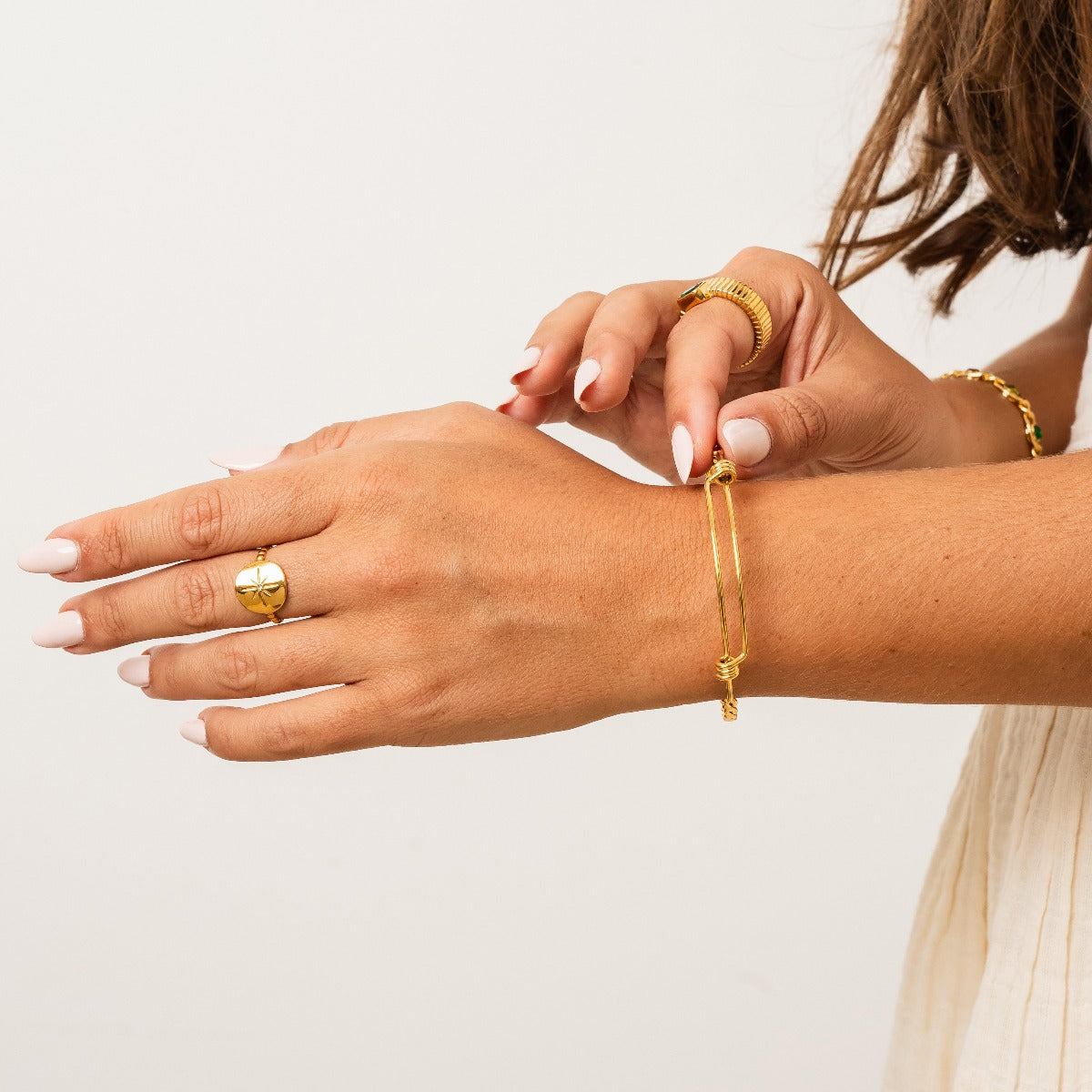 Malak Sydney Dainty Bangle in Gold, showcasing its elegant design and premium finish.