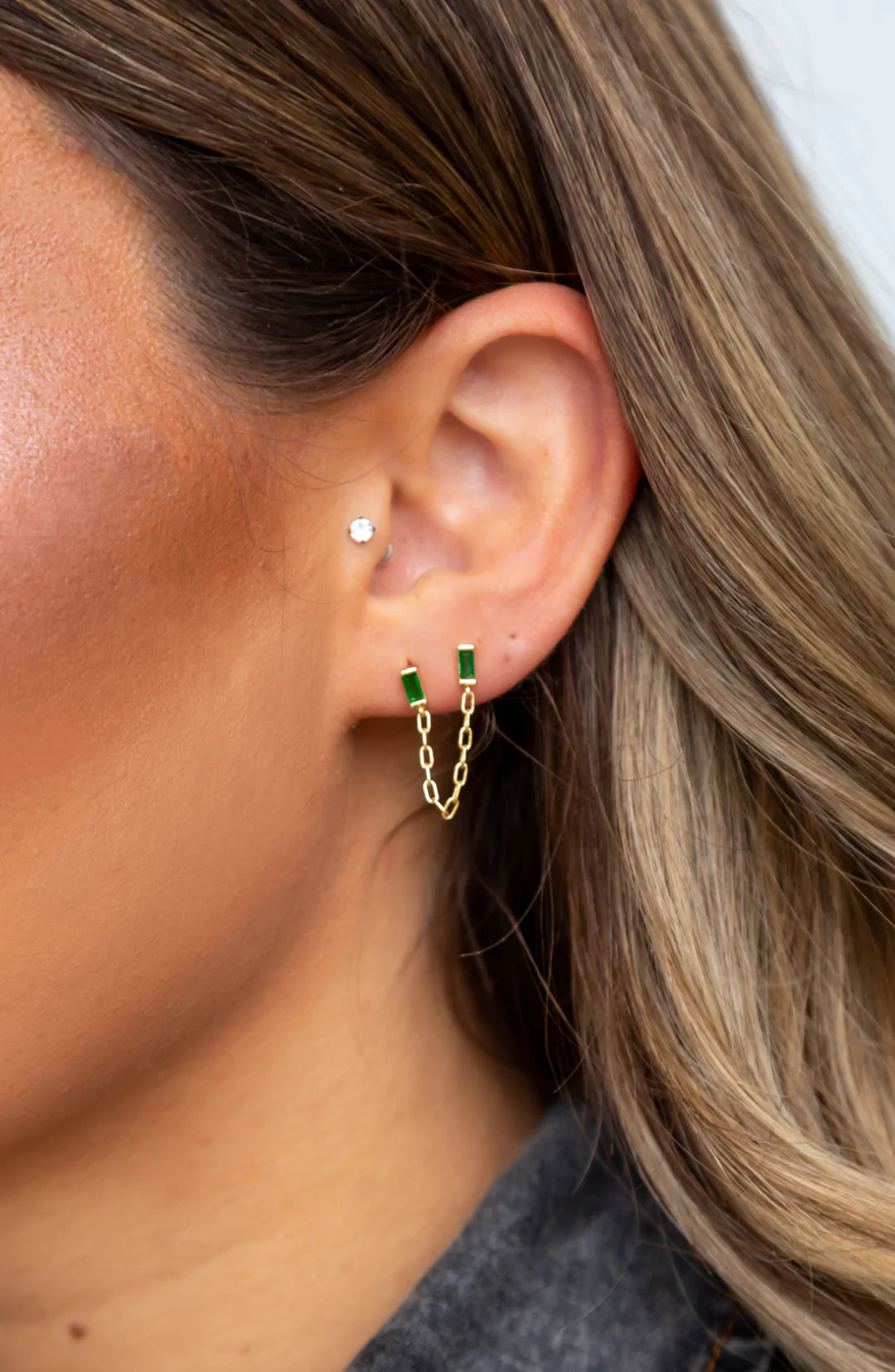 Malia Emerald Double Stud Earring featuring vibrant emerald CZ stones set in 18k gold plated stainless steel.