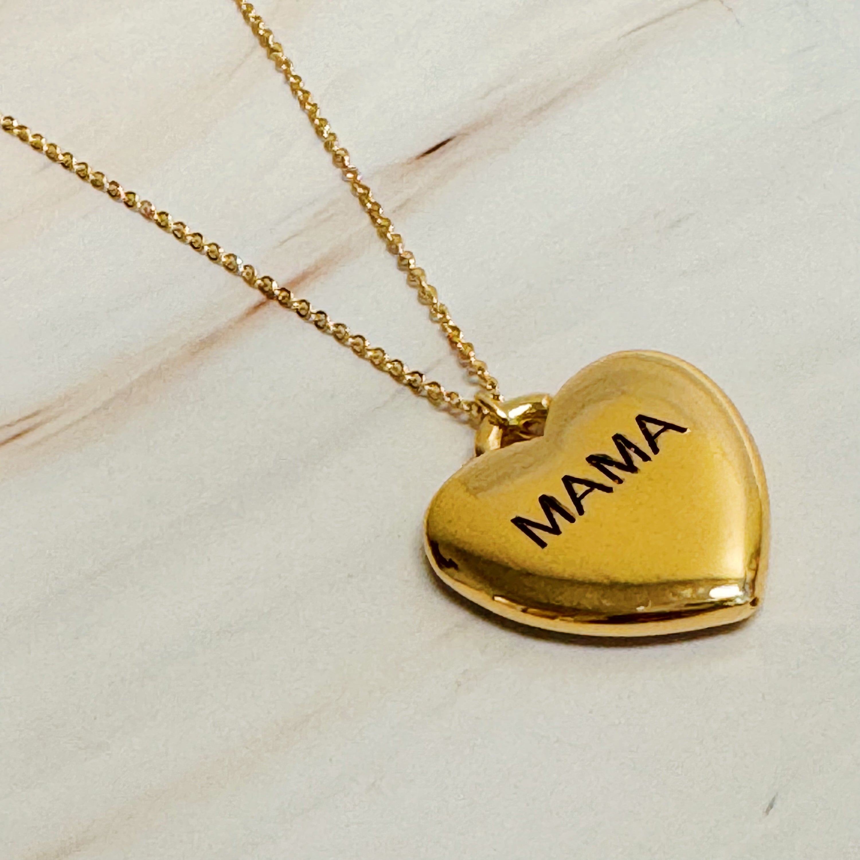 Mama Engraved Heart Pendant Necklace featuring a heavy heart lock pendant with 'mama' engraving on a stylish chain.