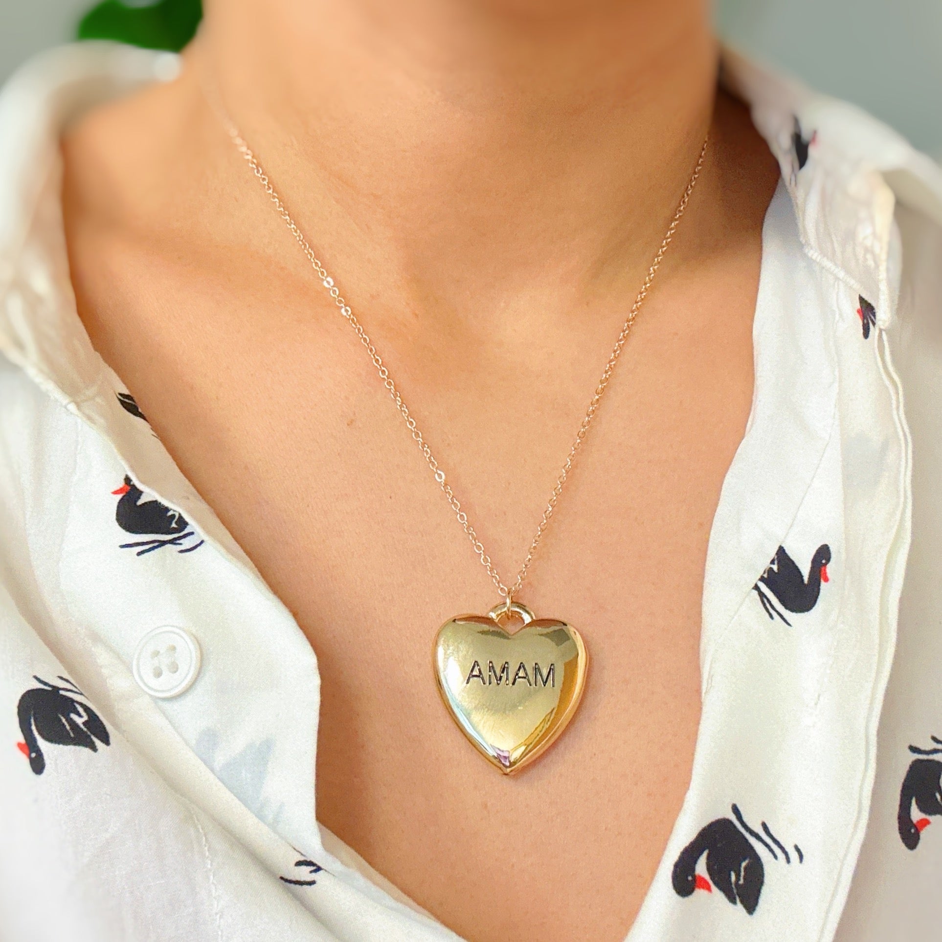 Mama Engraved Heart Pendant Necklace featuring a heavy heart lock pendant with 'mama' engraving on a stylish chain.