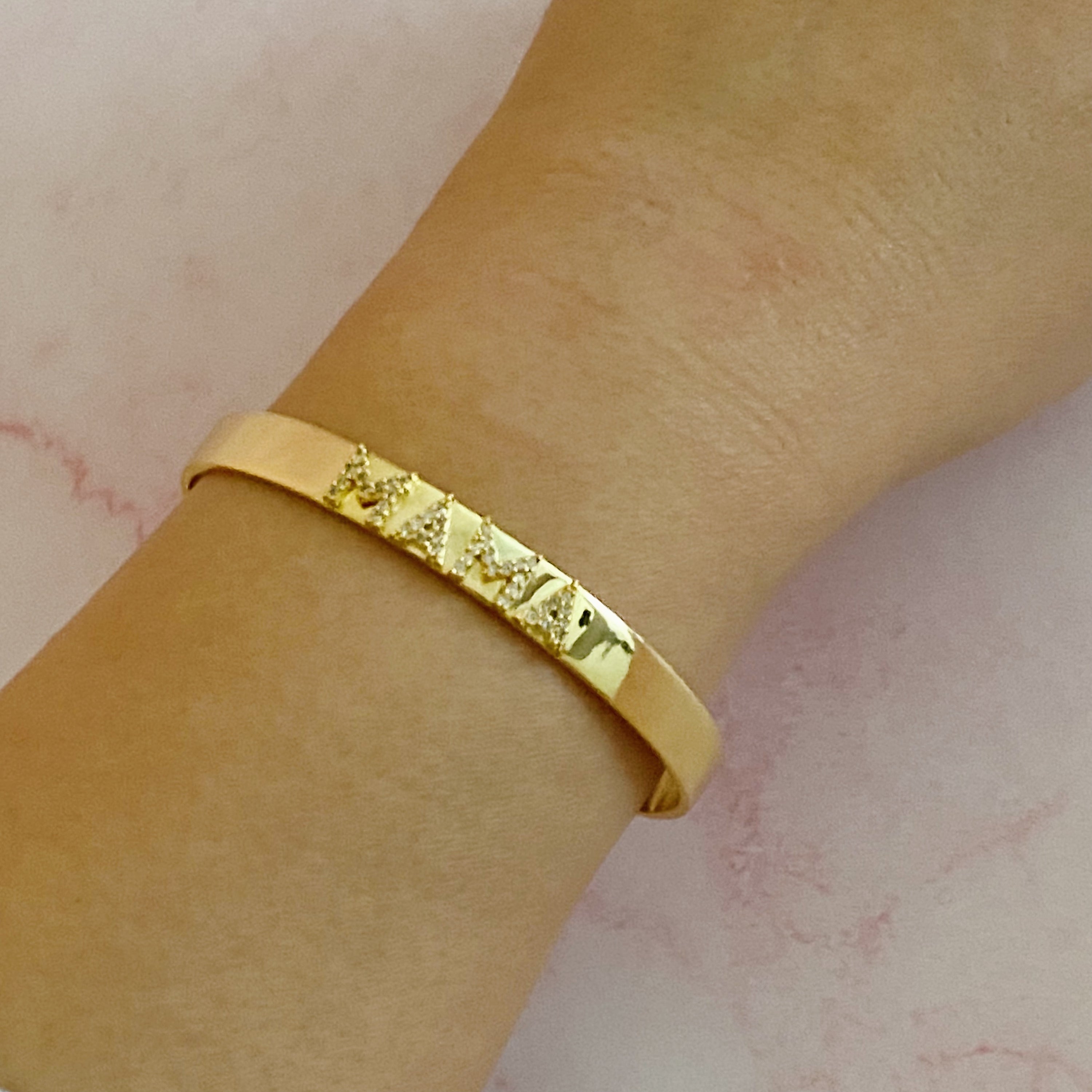 Mama Open Bangle Bracelet featuring shiny cubic zirconia stones on an elegant gold plated design.