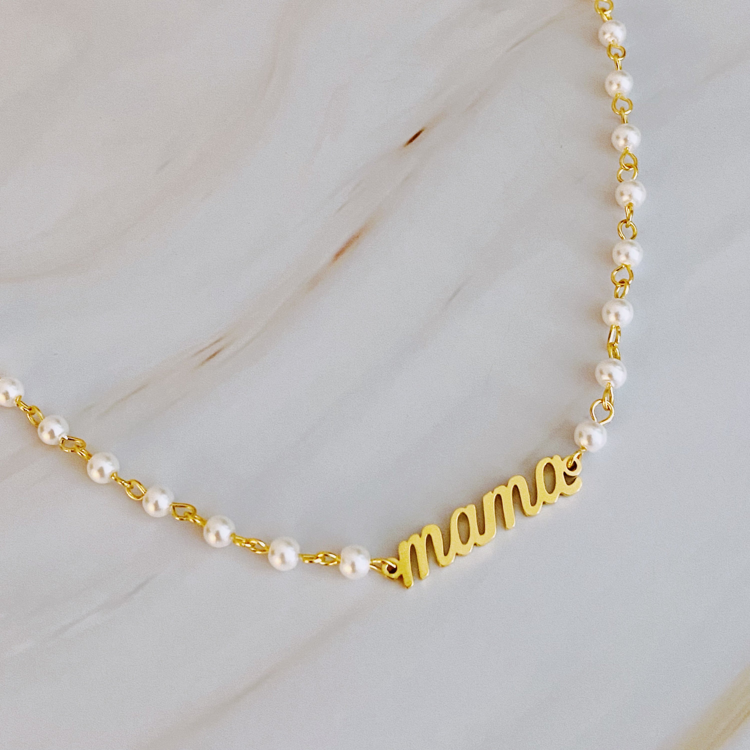 Mama Pearl Chain Necklace featuring a pearl chain and scripted MAMA cutout pendant, elegantly designed for stylish moms.