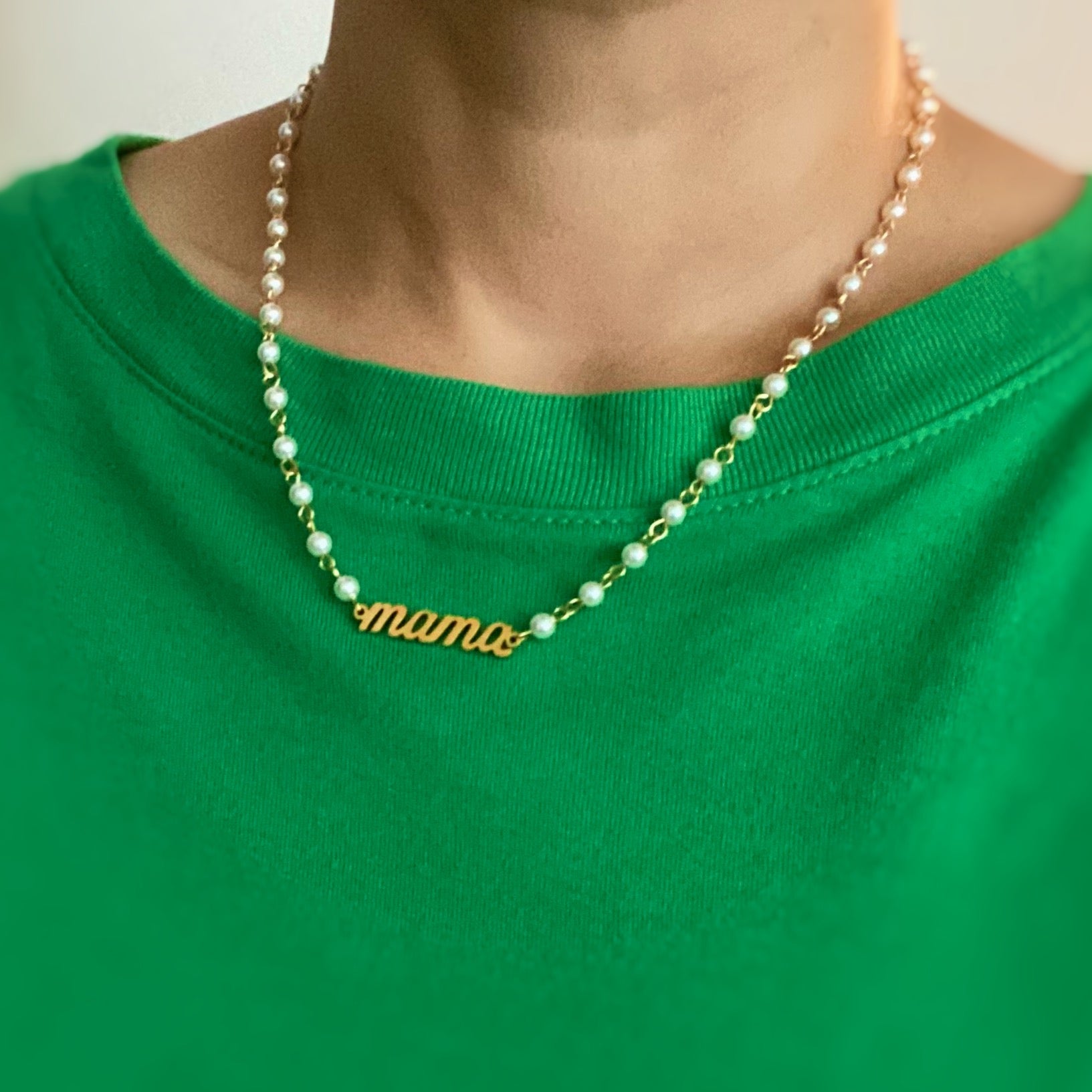 Mama Pearl Chain Necklace featuring a pearl chain and scripted MAMA cutout pendant, elegantly designed for stylish moms.