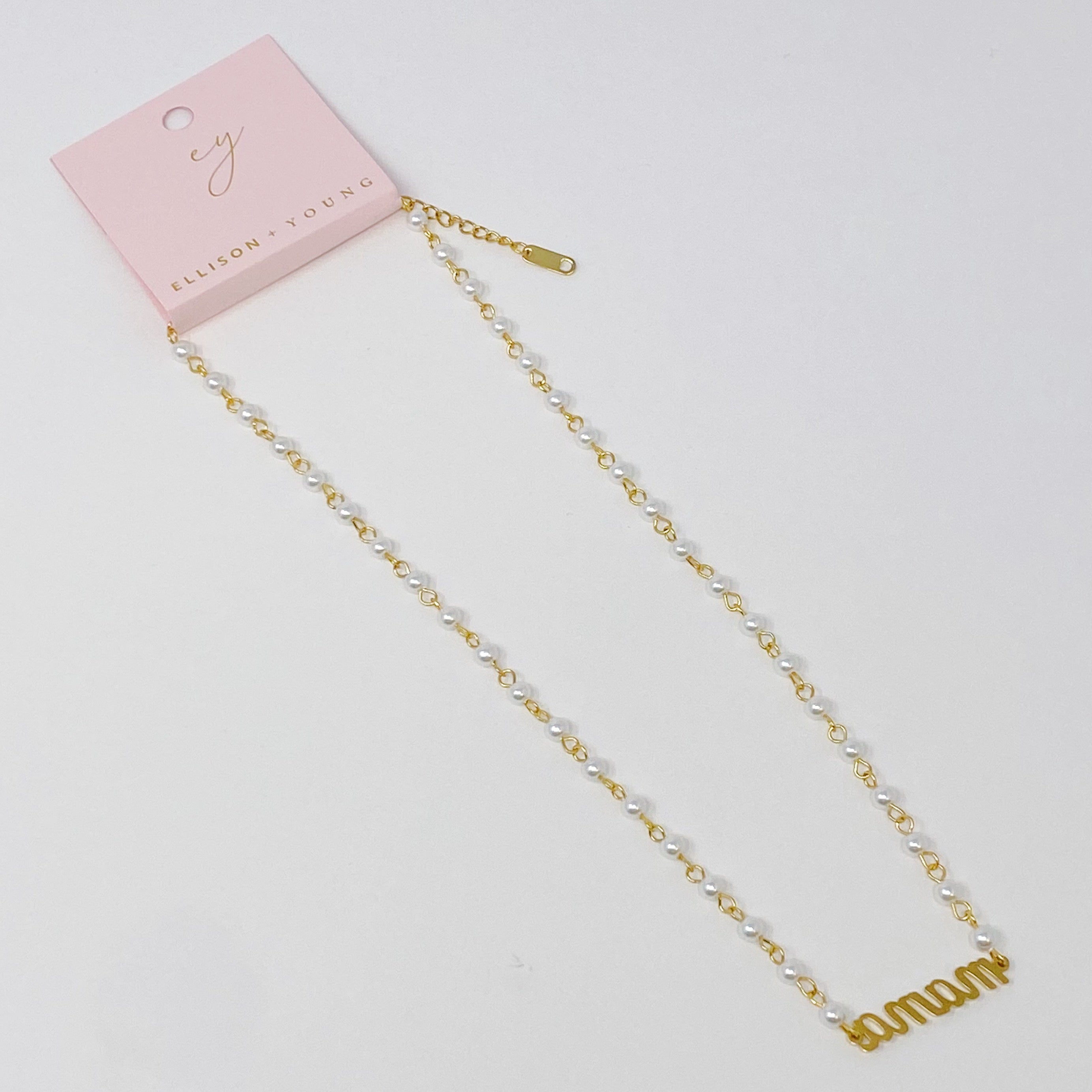 Mama Pearl Chain Necklace featuring a pearl chain and scripted MAMA cutout pendant, elegantly designed for stylish moms.