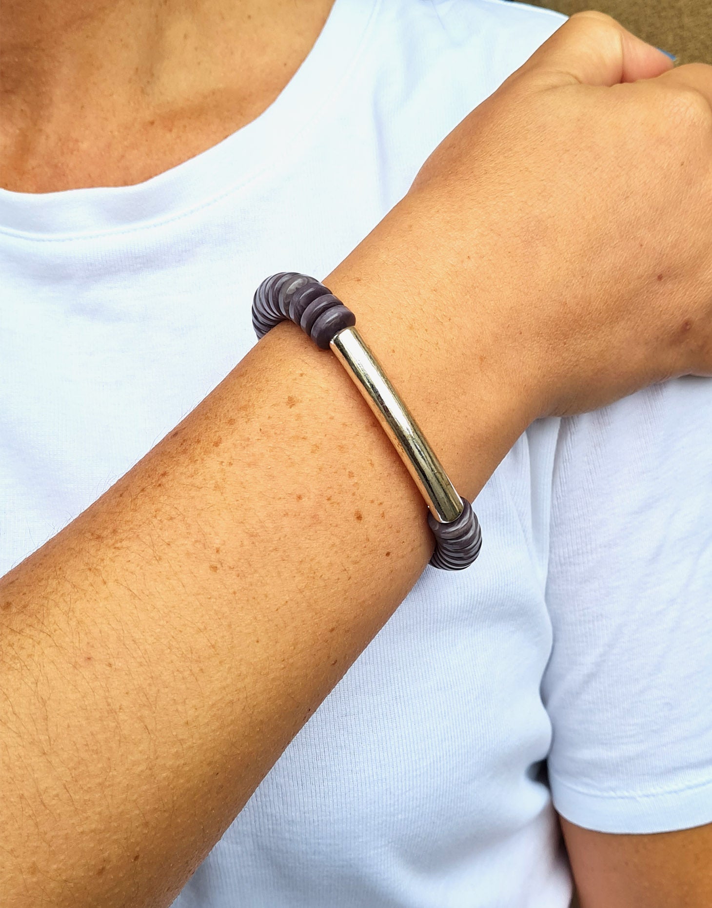 Manaus Bracelet featuring a sleek silver plated tube design, perfect for layering with other jewelry.