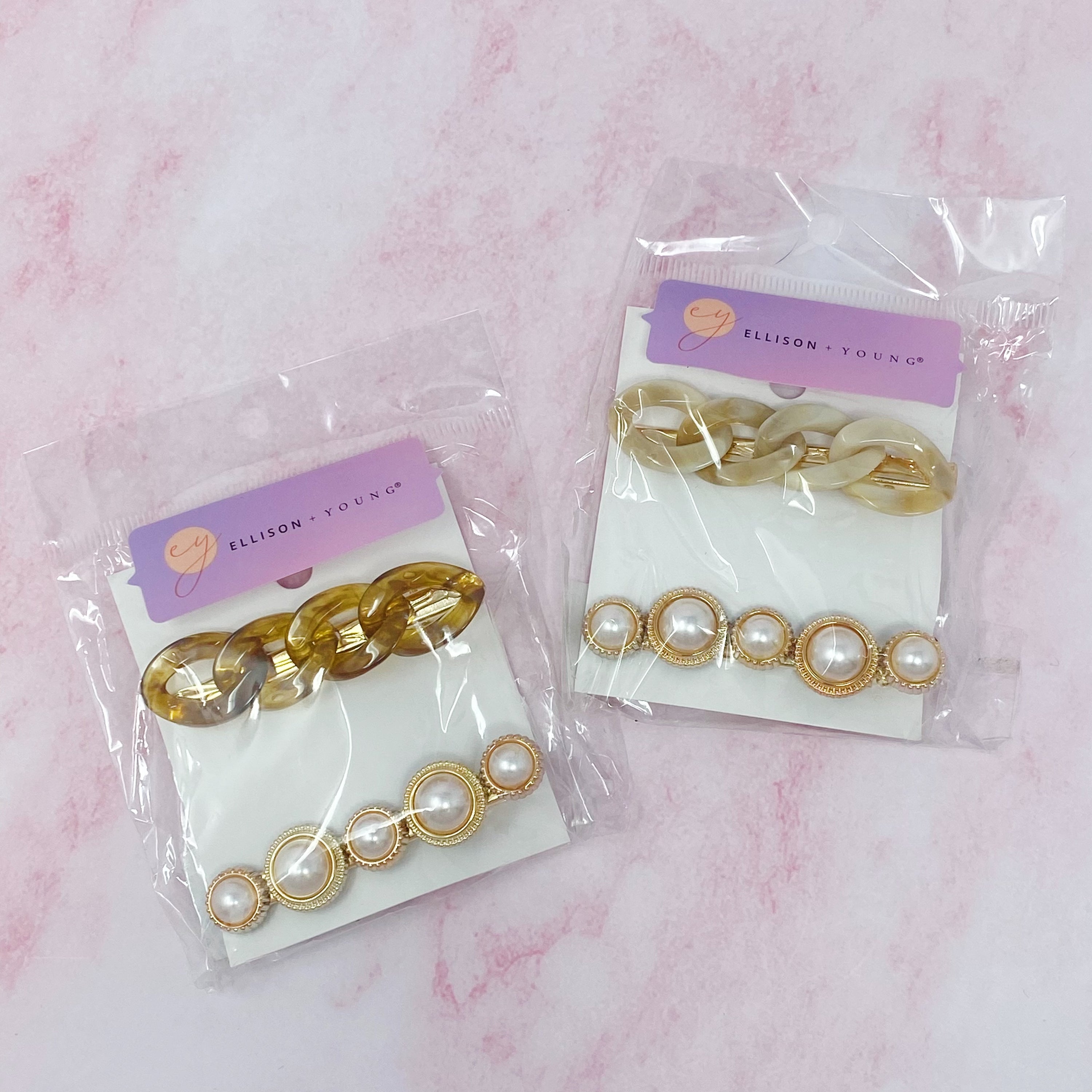 A stylish Marble Chain and Pearl Hair Clip Set featuring two elegant clips with neutral marble chains and pearl accents.