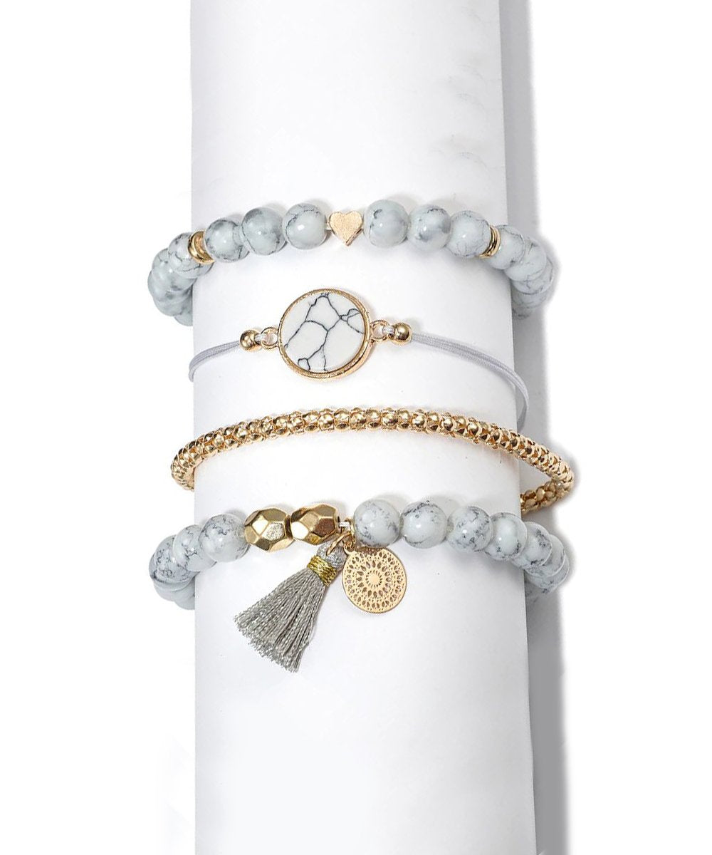 Elegant Marble Filligree Tassel Stretch Bracelet featuring 14K white gold plating and unique design elements, perfect for all occasions.