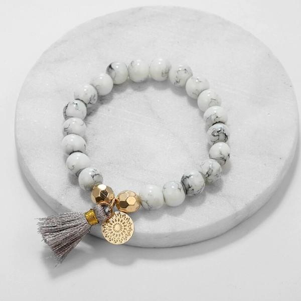 Elegant Marble Filligree Tassel Stretch Bracelet featuring 14K white gold plating and unique design elements, perfect for all occasions.