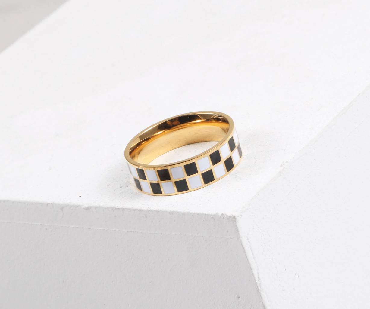 Margaux Black and White Karo Block Band featuring a classic check-board design in stainless steel with 18Kt yellow gold coating.