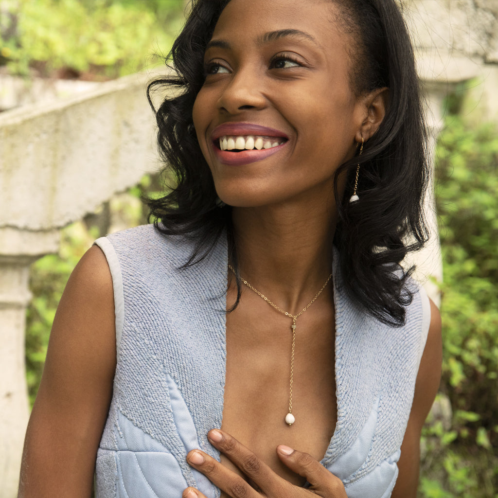 Marie-Rose Lariat Necklace featuring a natural Haitian Majok seed on a delicate gold plated chain with jasper rondelle details.