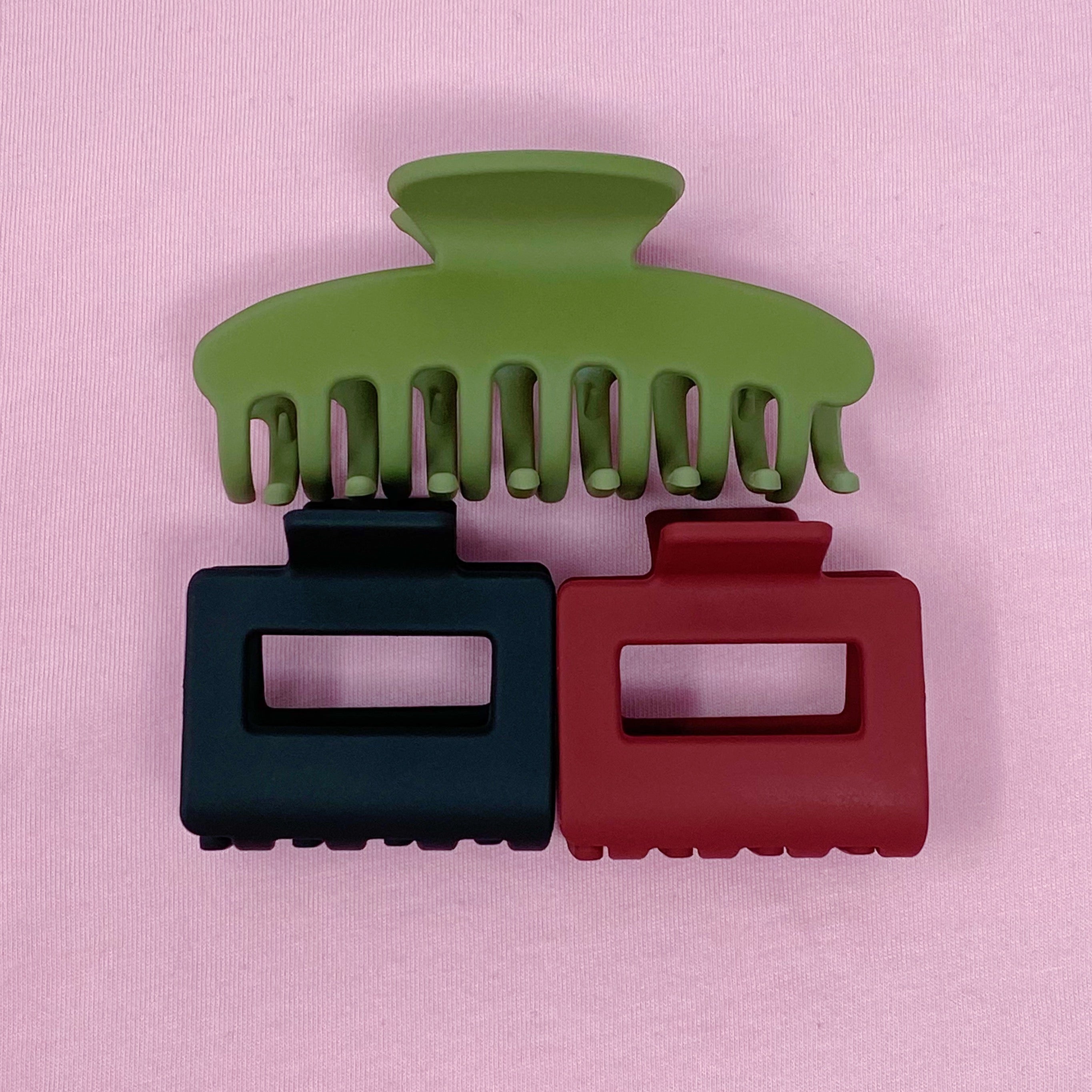 A stylish set of matte muted hair claws in various sizes and colors, perfect for elegant hairstyles.